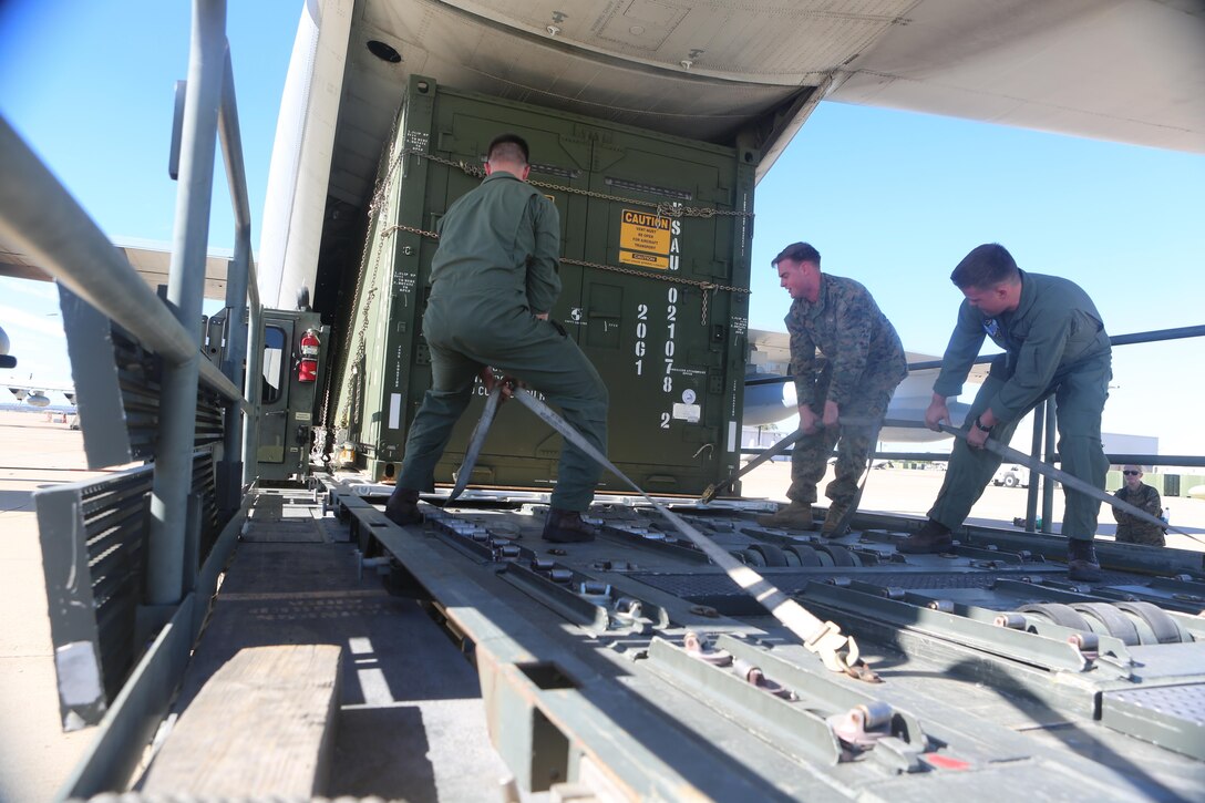 Marines of 3rd Marine Aircraft Wing proceed to remove the Tactical Imagery Production System from the KC-130J Super Hercules during a loading exercise aboard Marine Corps Air Station Miramar, Calif., Nov. 20. A TIPS is a highly-mobile, rapidly-deployable, self-contained tactical shelter system with imagery and reproduction capabilities that can be used while deployed in austere conditions.