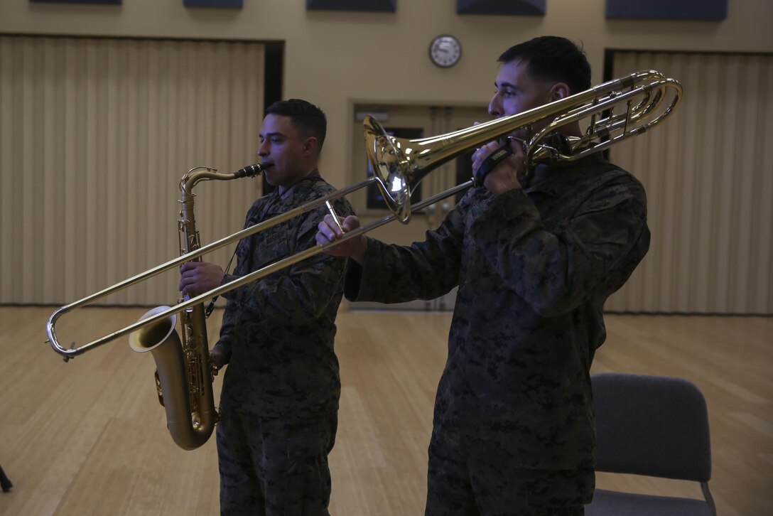 Staff Sgt. Alexander Panos, a trombone player with the 1st Marine Division Band, rehearses alongside his fellow Marines aboard Marine Corps Base Camp Pendleton, Nov. 23, 2015. Panos was recognized as the Marine Corps Musician of the Year Award for 2015. (U.S. Marine Corps photo by Cpl. Will Perkins/ RELEASED)