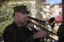 Staff Sgt. Alexander Panos, a trombone player with the 1st Marine Division Band, rehearses alongside his fellow Marines aboard Marine Corps Base Camp Pendleton, Nov. 23, 2015. Panos was recognized as the Marine Corps Musician of the Year Award for 2015. (U.S. Marine Corps photo by Cpl. Will Perkins/ RELEASED)
