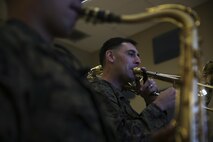 Staff Sgt. Alexander Panos, a trombone player with the 1st Marine Division Band, rehearses alongside his fellow Marines aboard Marine Corps Base Camp Pendleton, Nov. 23, 2015. Panos was recognized as the Marine Corps Musician of the Year Award for 2015. (U.S. Marine Corps photo by Cpl. Will Perkins/ RELEASED)