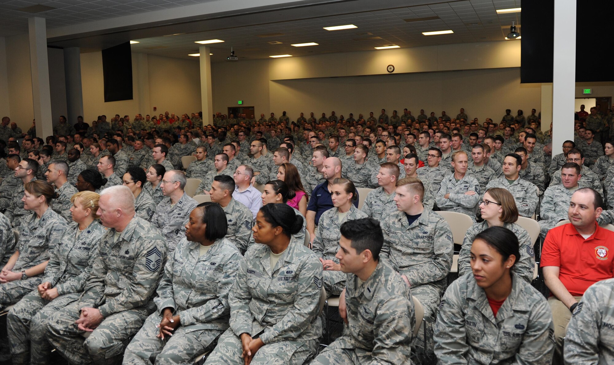 Keesler Airmen listen as Col. Michele Edmondson, 81st Training Wing commander, speaks during the final commander’s call at the Roberts Consolidated Aircraft Maintenance Facility Nov. 20, 2015, Keesler Air Force Base, Miss. The event was the final one of several wing events held during Wingman Week to reinforce the wingman concept and focus on unit cohesion and wellness. (U.S. Air Force photo by Kemberly Groue)