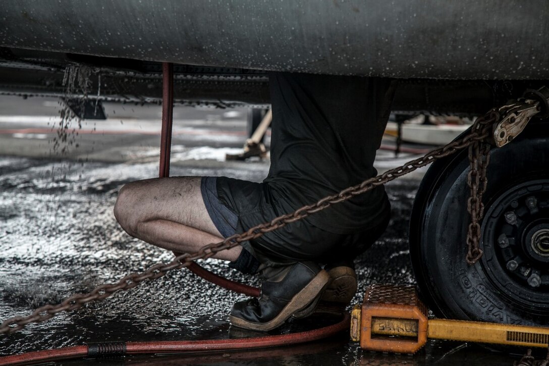 PACIFIC OCEAN (Nov. 23, 2015)  A U.S. Marine with Marine Medium Tiltrotor Squadron 161 (Reinforced), 15th Marine Expeditionary Unit, scrubs an aircraft on the flight deck of the USS Essex (LHD 2). The 15th MEU is currently deployed in the Indo-Asia-Pacific region to promote regional stability and security in the U.S. 7th Fleet area of operations. (U.S. Marine Corps photo by Cpl. Elize McKelvey/Released)