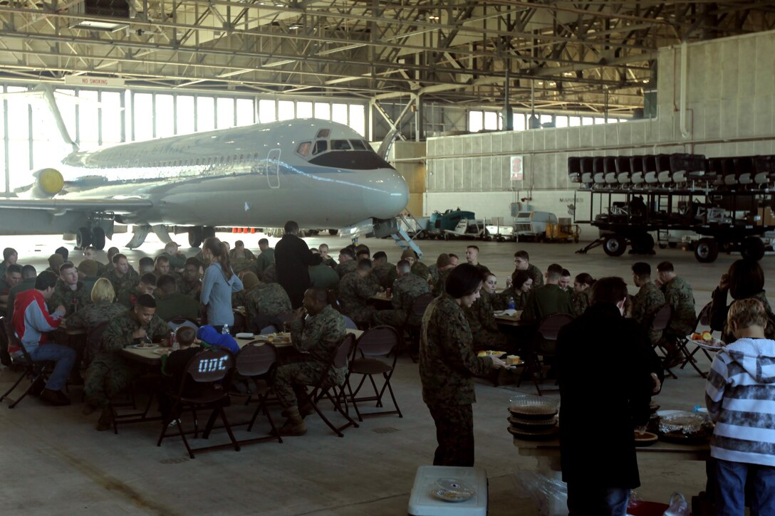 Marines and Sailors of Marine Transport Squadron 1 enjoy a Thanksgiving lunch at Marine Corps Air Station Cherry Point, N.C., Nov. 25, 2015. This is the fourth year that the Havelock community has come to the air station to offer the squadron a Thanksgiving meal as a way to show their thanks for all that the Marines do. (U.S. Marine Corps photo by Pfc. Nicholas P. Baird/ Released)