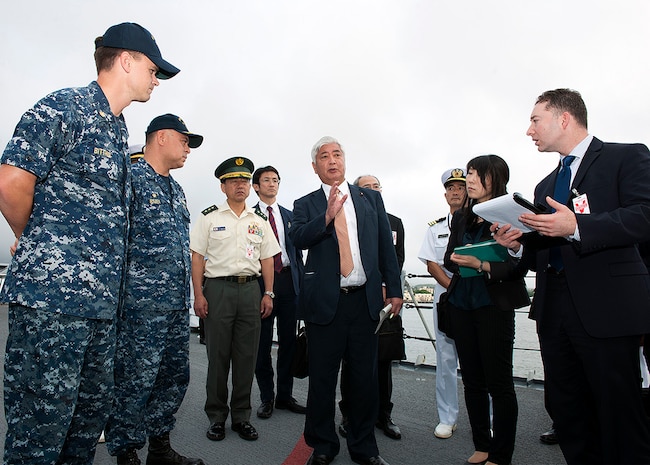 PEARL HARBOR (Nov. 23, 2015) Gen Nakatani, center, the Japanese Minister of Defense, speaks with Capt. Adolfo Ibarra, second from left, commanding officer of the guided-missile cruiser USS Port Royal (CG 73), and staff members of Nakatani's cabinet during a tour of the ship as part of Nakatani's visit to Pearl Harbor. Nakatani and his staff were visiting Pearl Harbor to learn more about the U.S. Navy's Aegis Ballistic Missile Defense System. 