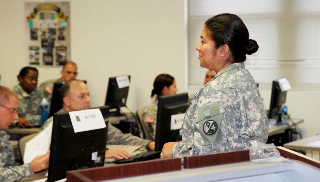 Master Sgt. Maria Ramos, an instructor for phase 1 of the 94th Training Division's Finance Senior Leaders Course at Fort Dix, New Jersey, addresses the class and goes over specifics for the day's lesson plan. SLC Students will each have the opportunity to teach a block of instruction on an aspect of finance as part of their training.  Ramos is a guest instructor from 7th Battalion, 95th Regiment out of Grand Prairie, Texas.   