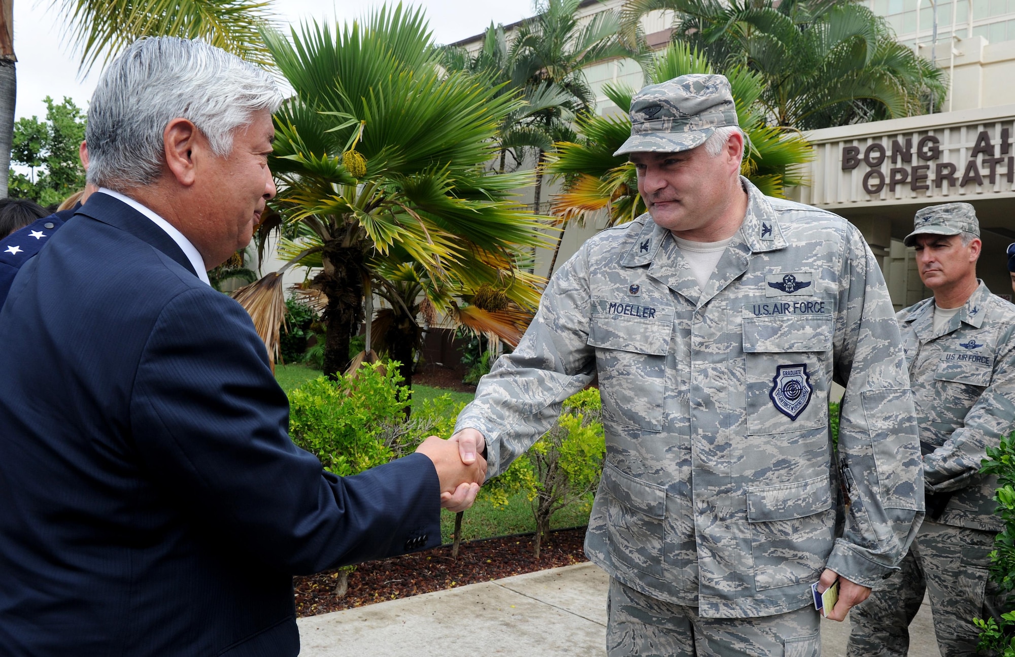 U.S. Air Force Col. David Moeller, 613th Air Operations Center commander, greets Japan Minister of Defense Gen Nakatani, during his visit to the 613th AOC Nov. 23, 2015, at Joint Base Pearl Harbor-Hickam, Hawaii. Nakatani and members of his defense forces were here to conduct bilateral talks with U.S. Pacific Command and PACAF about ongoing and future operations in the pacific. (U.S. Air Force photo by Staff Sgt. Alexander Martinez/Released)