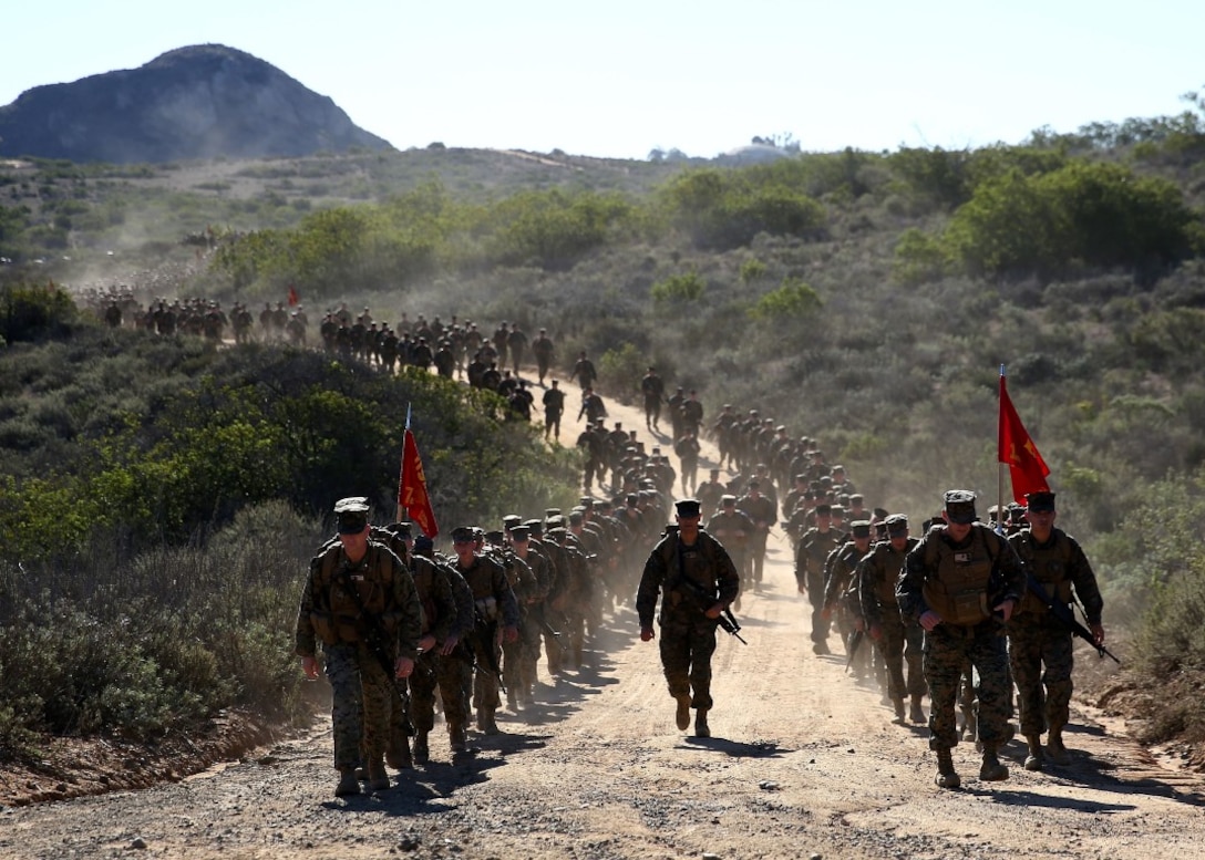 Marines trek the remaining distance of their nine-mile hike through the Juliet Training Area after filling wooden grates with canned goods aboard Marine Corps Base Camp Pendleton, Calif., Nov. 20, 2015. 
The Marines packed canned goods along with their gear in their packs to help local charities. 7th Engineer Support Battalion collected approximately 10,000 pounds of canned goods that will be donated to the Women’s Resource Center and Brother Benno’s, both in Oceanside, Calif. The organizations’ mission is to help those less fortunate in the community. The Marines are with 7th ESB, 1st Marine Logistics Group, I Marine Expeditionary Force, Marine Corps Base Camp Pendleton, Calif. 
(U.S. Marine Corps photo by Lance Cpl. Timothy Valero)
