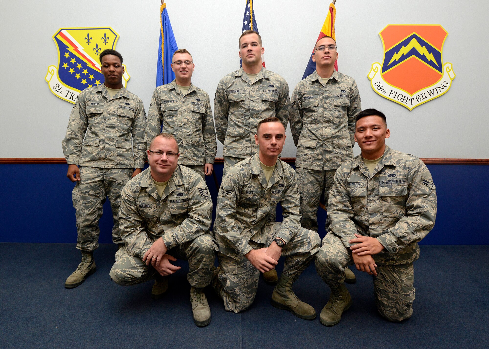 Detachment 12, 372nd Training Squadron mission ready Airmen pose for a group photo  during the MRA Graduation ceremony at Luke Air Force Base, Ariz., Nov. 23, 2015. The MRA program teaches Airmen F-16 launching, recovering, and pre and post-flight inspections preparing them to maintain aircraft at their duty stations. (U.S. Air Force photo by Senior Airman Devante Williams)