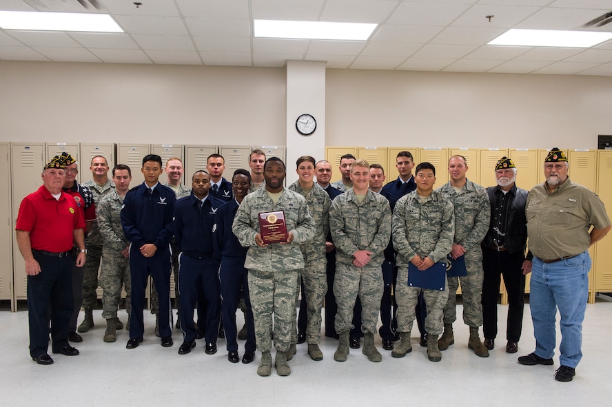 Moody’s Base Honor Guard and leaders of the American Legion Post 115 pose for a photo, during an awards ceremony, Nov. 24, 2015, at Moody Air Force Base, Ga. American Legion Post 115 recognized the honor guard members for their outstanding service and unwavering support while rendering honors over the last two months. (U.S. Air Force Senior Airman Ceaira Tinsley/Released)