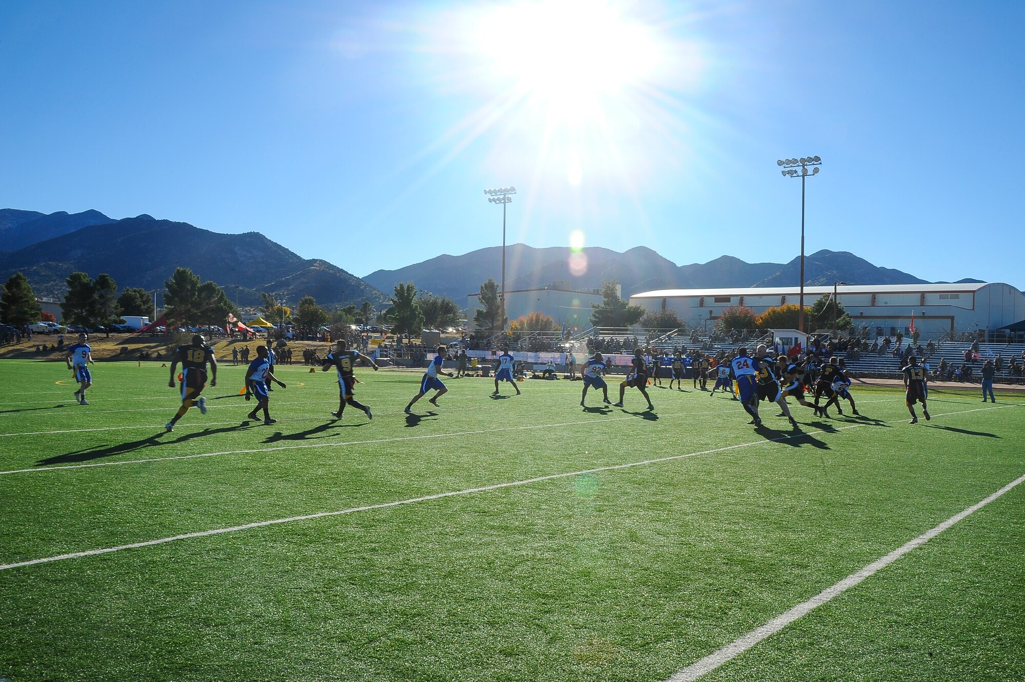 The Davis-Monthan Air Force Base Mustangs play against the Fort Huachuca Black Knights during the Turkey Bowl 2015 at Fort Huachuca, Ariz., Nov. 20, 2015. Along with the free game, the Fort Huachuca Chaplains’ local food locker was accepting donations such as canned goods, baby supplies and hygiene products. (U.S. Air Force photo by Airman 1st Class Mya M. Crosby/Released)