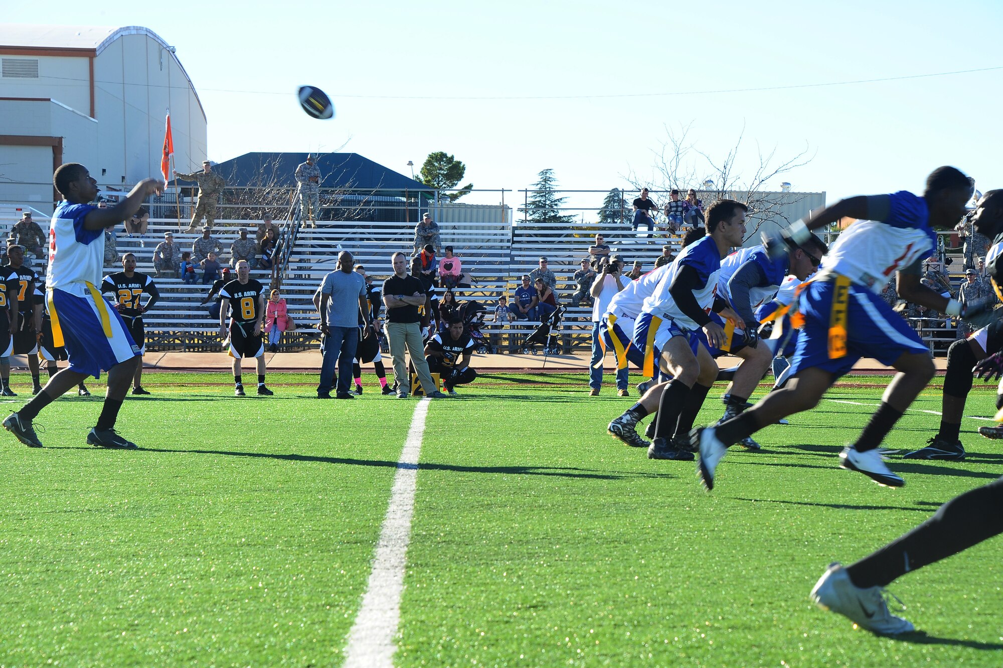 U.S. Air Force 2nd Lt. Allante Staten, Davis-Monthan Air Force Base Mustangs quarterback, receives a snap from the center during the Turkey Bowl 2015 at Fort Huachuca, Ariz., Nov. 20, 2015. The Turkey Bowl 2015 was the second game between D-M AFB and Fort Huachuca. (U.S. Air Force Airman 1st Class Mya M. Crosby/Released)