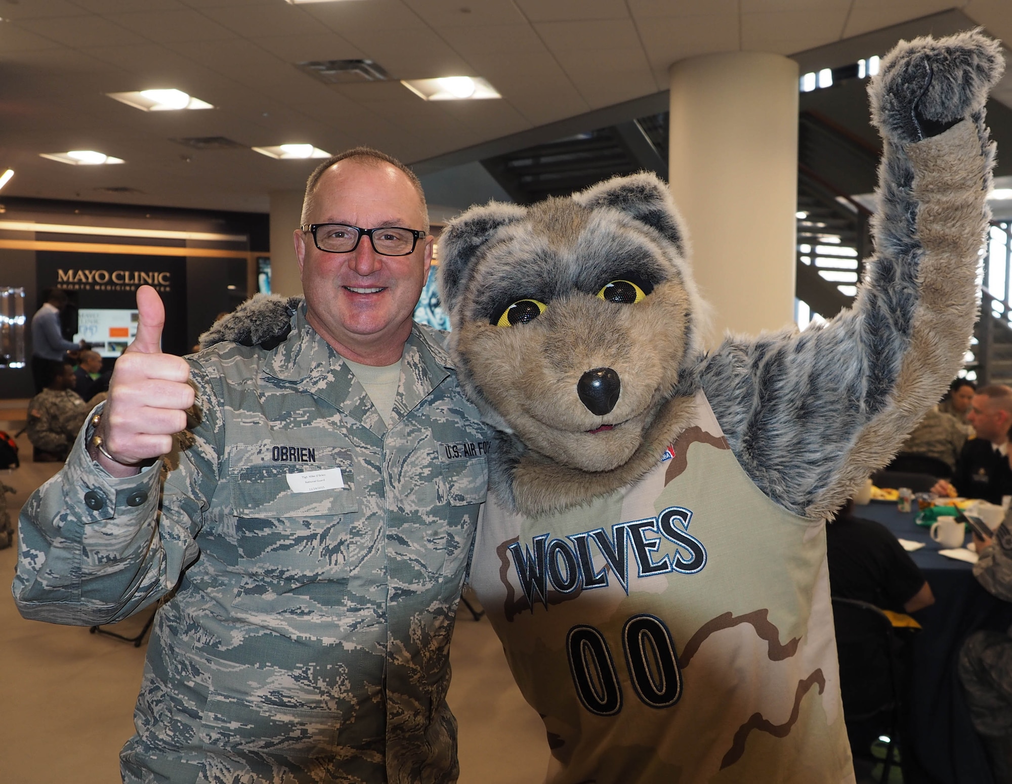 Tech. Sgt. Mike O'Brien, 934th Communications Squadron, poses with mascot Crush. (Air Force Photo/Paul Zadach)