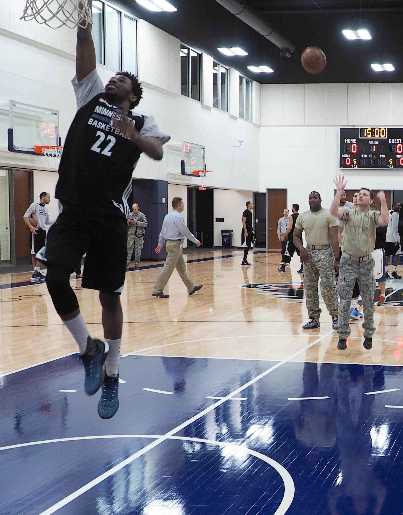 Master Sgt. Cory Copa, 934th Aeromedical Evacucuation Squadron, goes up against Timberwolves Shooting Guard Andrew Wiggins during the Knockout competition. Copa was able to knock Wiggins out of the contest. (Air Force Photo/Paul Zadach)
