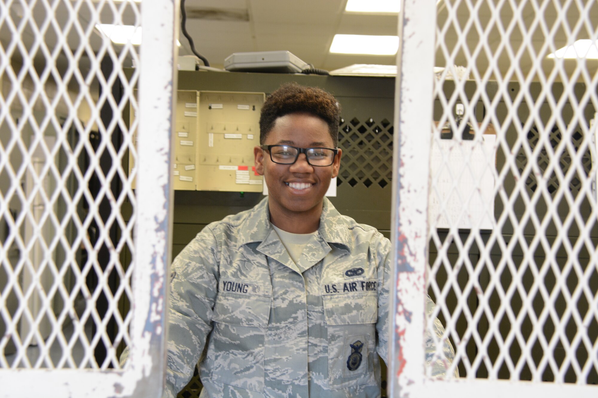 Airman 1st Class Sherese Young, 60th Security Forces Squadron armorer, poses for a photo Nov. 18 at Travis Air Force Base, California. Armorers are  responsible for arming, disarming and weapon accountability for the base. (U.S. Air Force photo by Airman 1st Class Amber Carter)