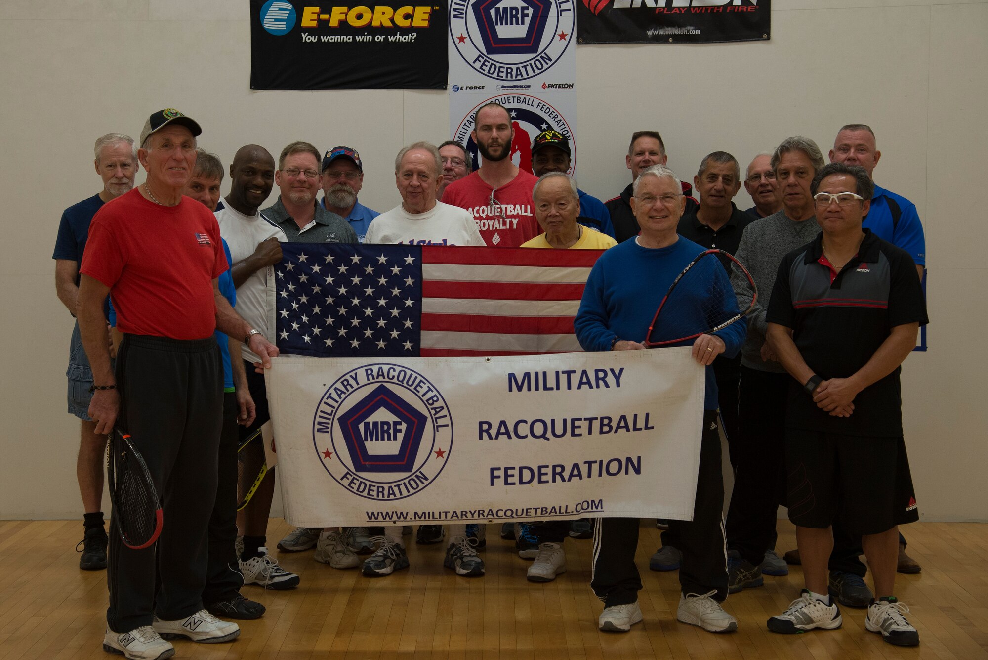 Members of the Jefferson Barracks and Military Racquetball Federation pose for a group photo November 13, 2015, at the James Sports Center. The director of the James Sports center, Master Sgt. Jeff Grew, and other Scott personnel participated and helped plan the clinic. (U.S. Air Force photo by Airman Gwendalyn Smith)
