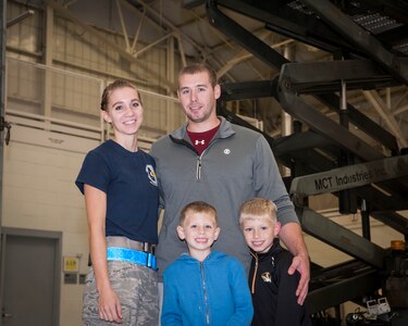 Airman 1st Class Nicole Pieper, 437th Maintenance Squadron aerospace journeyman and her husband, Senior Airman Kody Becker, 437 MXS aerospace reclamation technician, and their two sons pose for a photo following a Thanksgiving meal for 437 MXS swing-shift workers and their families, Nov 20, 2015, at Joint Base Charleston, SC. Swing-shift hours are from 2-11:30 p.m. and is one of three shifts that sustain the aircraft maintenance mission 24 hours per day. (U.S. Air Force photo by Capt. Christopher Love)
