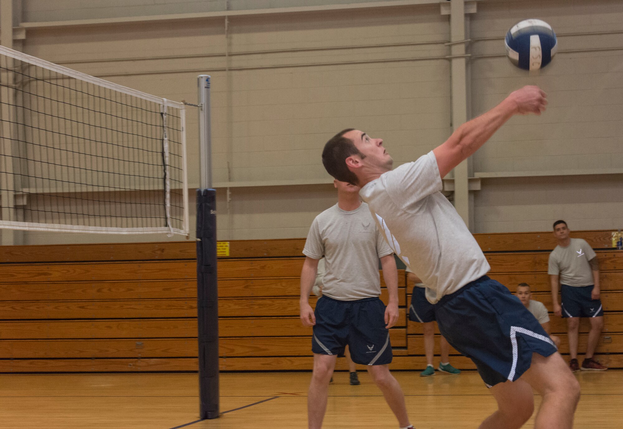 Senior Airman Eric Halchak, 437th Aircraft Maintenance Squadron crew chief, bumps the volleyball during a tournament against chief master sergeants and first sergeants from the installation at Joint Base Charleston – Air Base, S.C., on Nov. 23, 2015.  The volleyball tournament was held a teambuilding and communication exercise to prepare Airmen Leadership School students to be non-commissioned officers. (U.S. Air Force photo/Airman 1st Class Thomas T. Charlton)