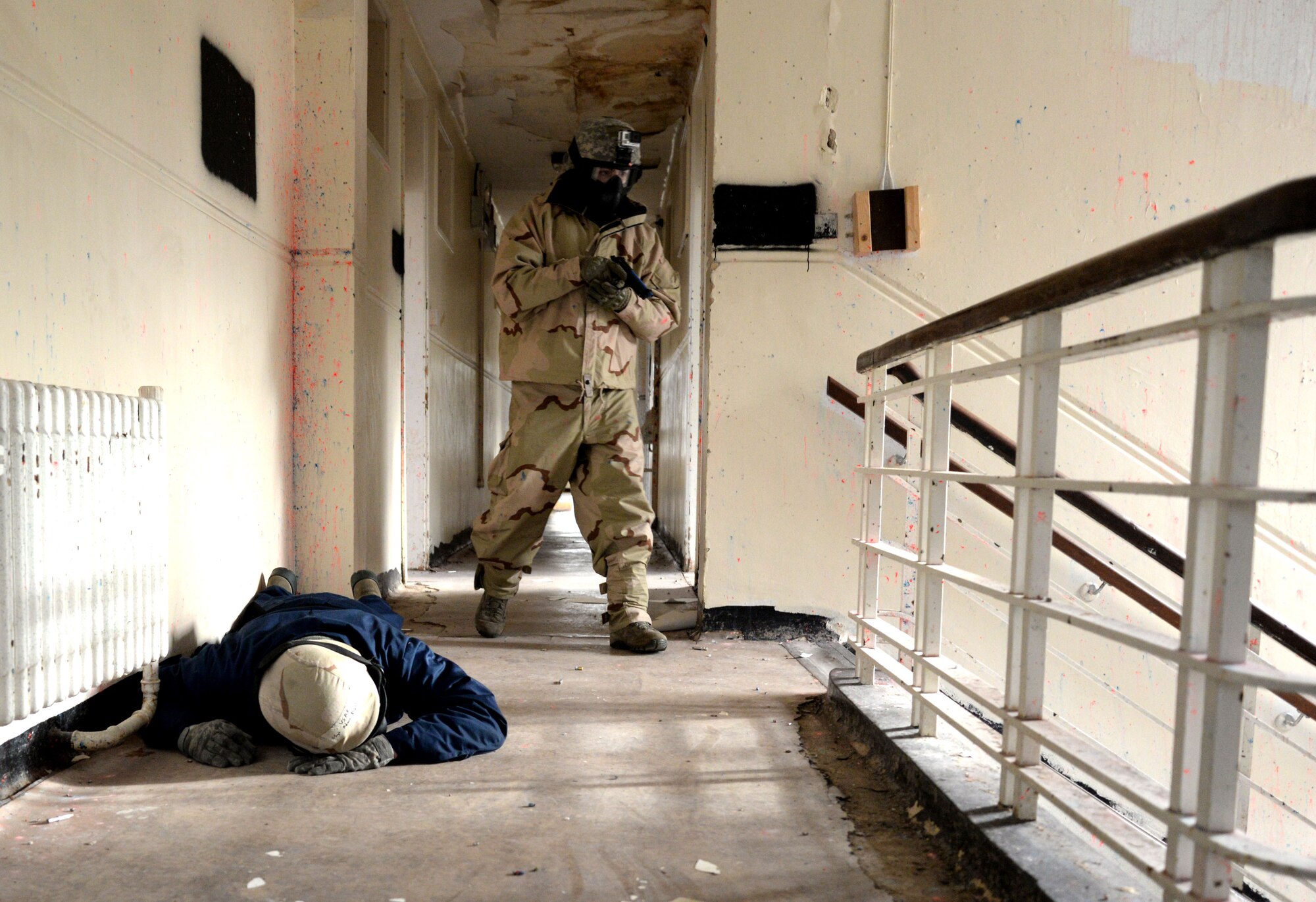 U.S. Air Force Senior Airman Daniel Duarte, 100th Security Forces Squadron scheduler, acts as an active shooter during expeditionary active shooter training Nov. 23, 2015, on RAF Feltwell, England. The new training, implemented Oct. 1, is designed to prepare deploying Airmen for an environment where firearms are potentially more prevalent, meaning they might be armed and have to protect themselves and others from the threat of an active shooter. (U.S. Air Force photo by Senior Airman Kate Thornton/Released)