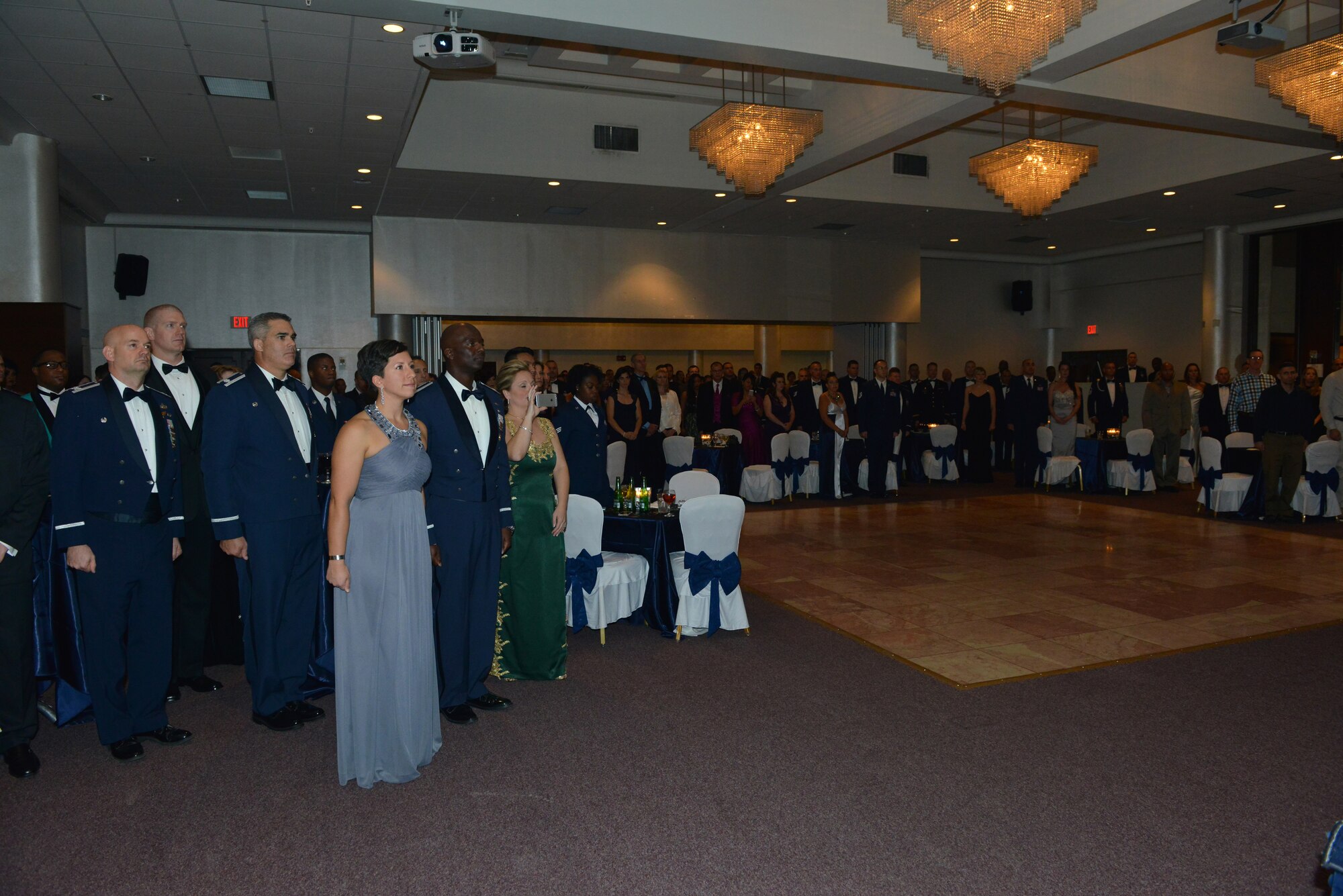 Members of ‘Team Incirlik’ stand for the presentation of the colors, Turkish anthem and National anthem during the 2015 Air Force Ball Nov. 13, 2015, at Incirlik Air Base, Turkey.  The event, held at the Club Complex here, celebrated the Air Force’s 68th birthday and the 60th anniversary of the U.S. military presence at Incirlik. (U.S. Air Force photo by Staff Sgt. Michael Battles)
