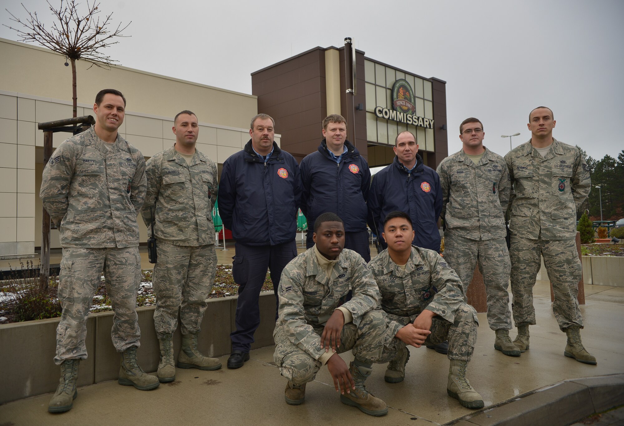 Firefighters from the 86th Civil Engineering Squadron stand in front of the commissary Nov. 25, 2015, at Ramstein Air Base, Germany. These firefighters saved millions of dollars in meat inventory and prevented any damage to the environment during a chemical leakage at the Defense Commissary Agency Storage facility, making sure over 50,000 people will enjoy the Thanksgiving holiday unhindered. (U.S. Air Force photo/Airman 1st Class Lane T. Plummer)