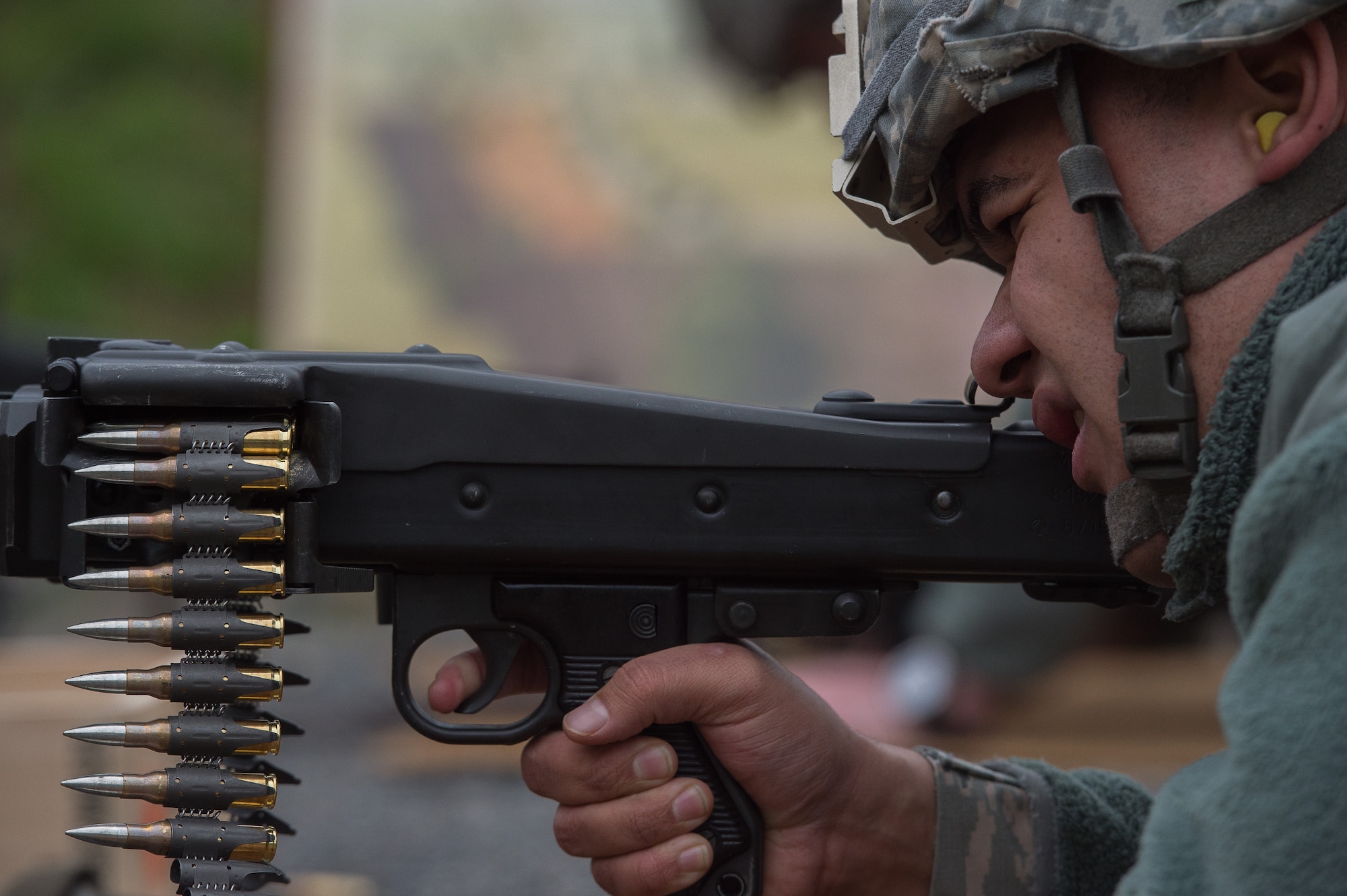 U.S. Air Force Senior Airman Anthony Bruner, 86th Security Forces Squadron member, aims an MG3 machine gun Nov. 18, 2015, at Zweibruecken, Germany. More than 20 members of the 86th SFS attempted to earn the Bundeswehr (German army) marksmanship badge by hitting targets with a variety of German weapons. (U.S. Air Force photo/Senior Airman Damon Kasberg)