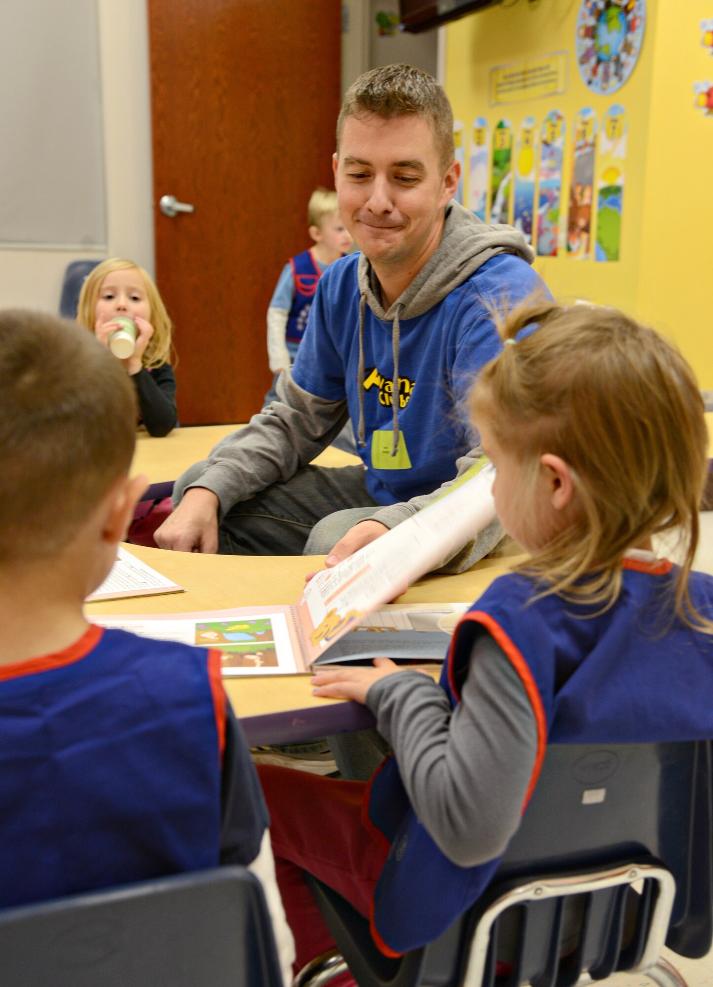 Master Sgt. Kevin Benedict, with the 552nd Air Control Network Squadron, teaches an Awana class for 4-6 year olds at his church. (Air Force photo by Kelly White/Released)