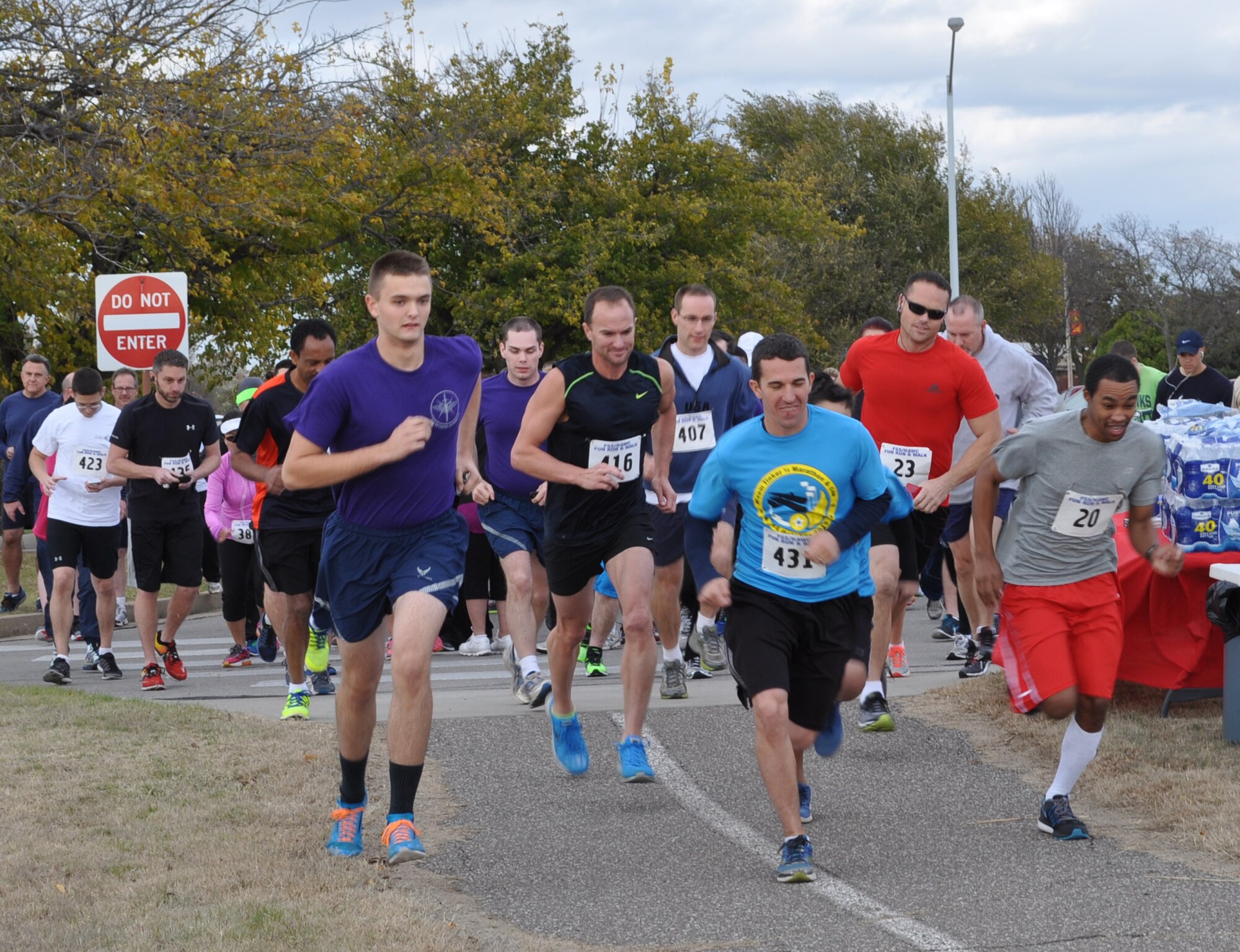 Runners take off at the starting line of the 2015 Great American Smokeout Turkey Trot, held Nov. 20.  (Air Force photo by Kimberly Woodruff/Released)