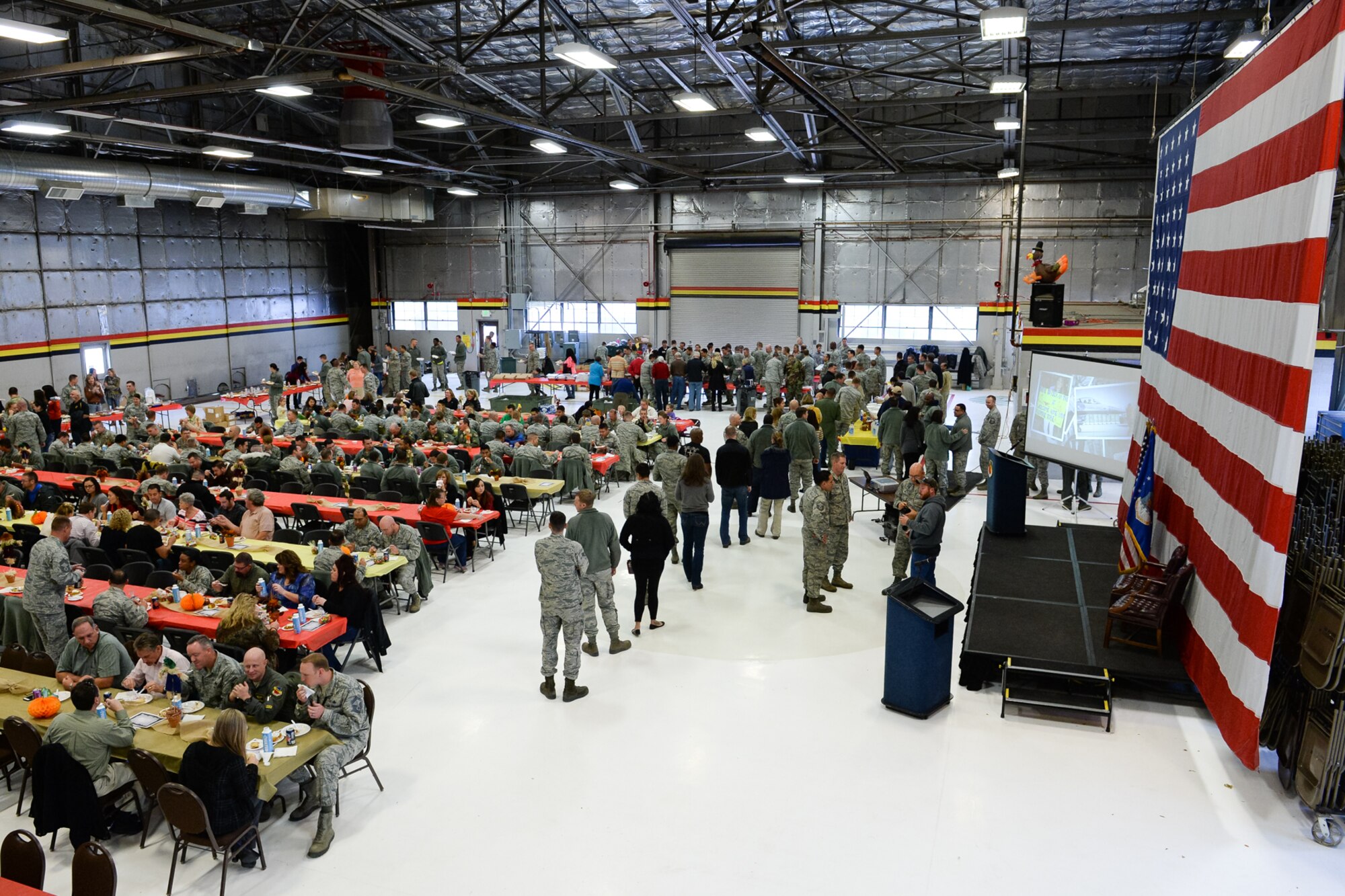 Airmen, family members and civilians attend the annual Thanksgiving feast hosted by the 388th and 419th Fighter Wings Nov. 24 in Hangar 37, Hill Air Force Base, Utah. (U.S. Air Force photo by R. Nial Bradshaw)
