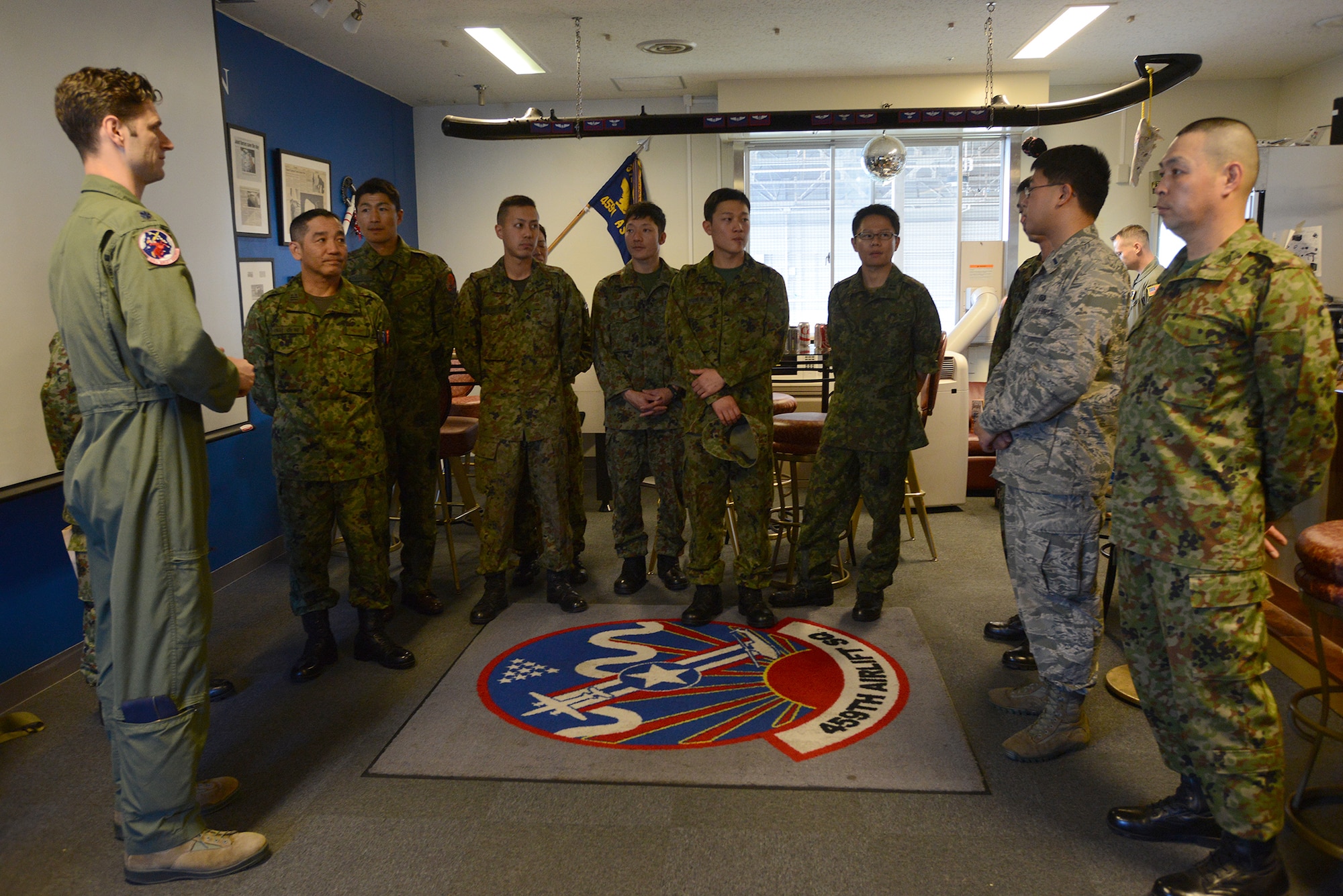 Lt. Col. William Martin, 459th Airlift Squadron commander, thanks members of the Japan Ground Self-Defense Force for taking part in a search and rescue capability exchange at Yokota Air Base, Japan, Nov. 16, 2015. The exchange included briefings on Japanese and U.S. night vision capabilities, a static display of a UH-1N Iroquois with a hoist and a barbecue. (U.S. Air Force photo by Senior Airman David C. Danford/Released)
