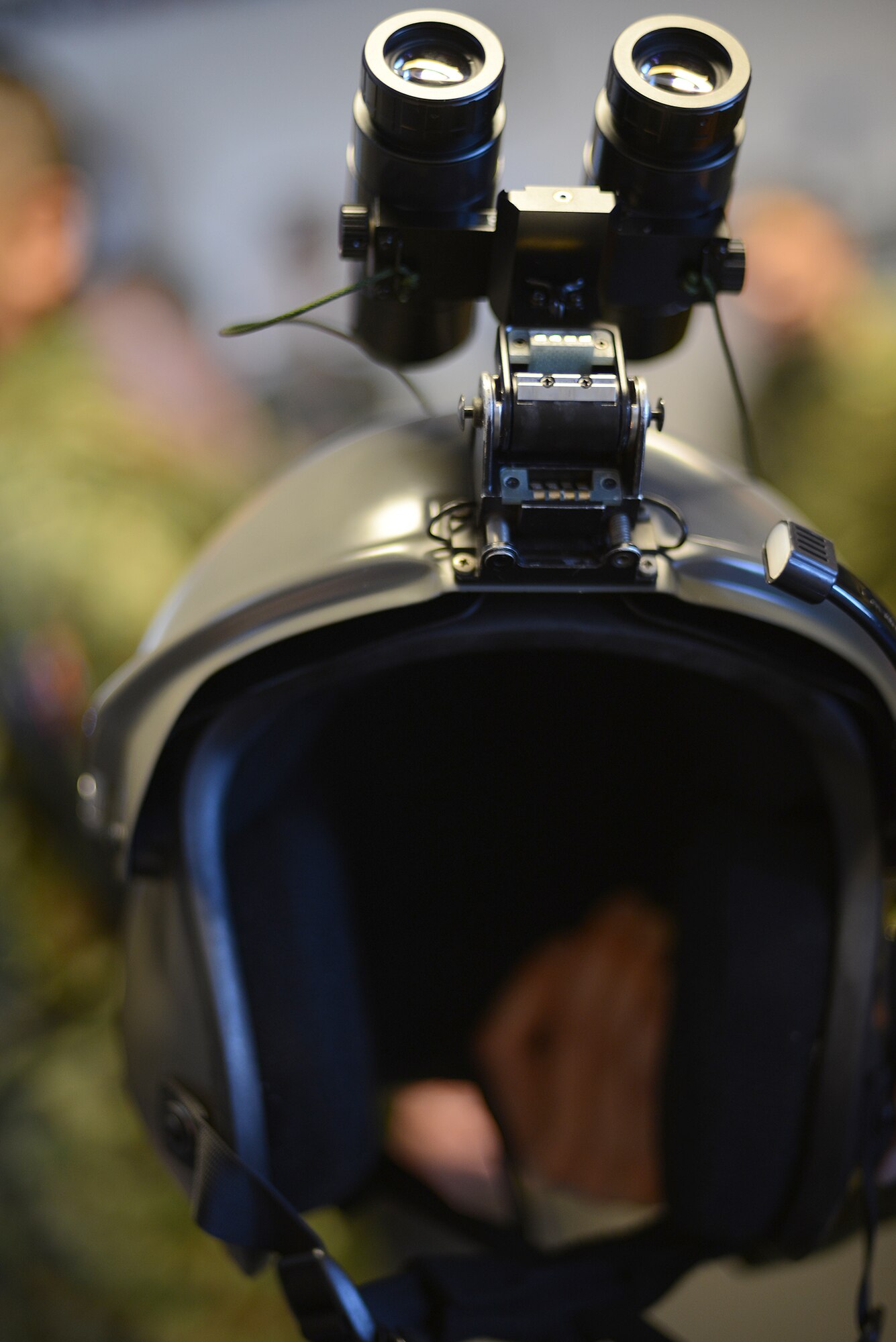 A Japan Ground Self-Defense Force helmet with an attached night vision device is displayed during a search and rescue capability exchange at Yokota Air Base, Japan, Nov. 16, 2015. The Japanese helmet is lighter but holds fewer battery packs, causing it to be front-heavy. (U.S. Air Force photo by Senior Airman David C. Danford/Released)