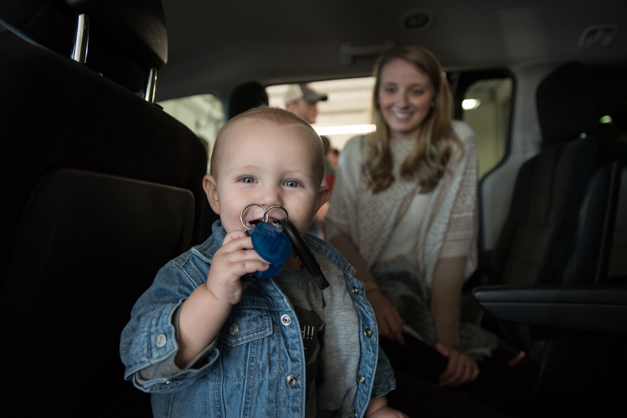 Dash Goodlin, the 6-month-old son of Staff Sgt. Neil Goodlin, plays with the keys to his family’s new minivan during an unveiling ceremony at Oxmoor Collision Center in Louisville, Ky., Nov. 20, 2015. The van was donated to Neil Goodlin, a fire team member in the Kentucky Air National Guard’s 123rd Security Forces Squadron, as part of the National Auto Body Council’s “Recycled Rides” program, which restores wrecked vehicles to like-new condition before giving them to needy individuals. (U.S. Air National Guard photo by Maj. Dale Greer)