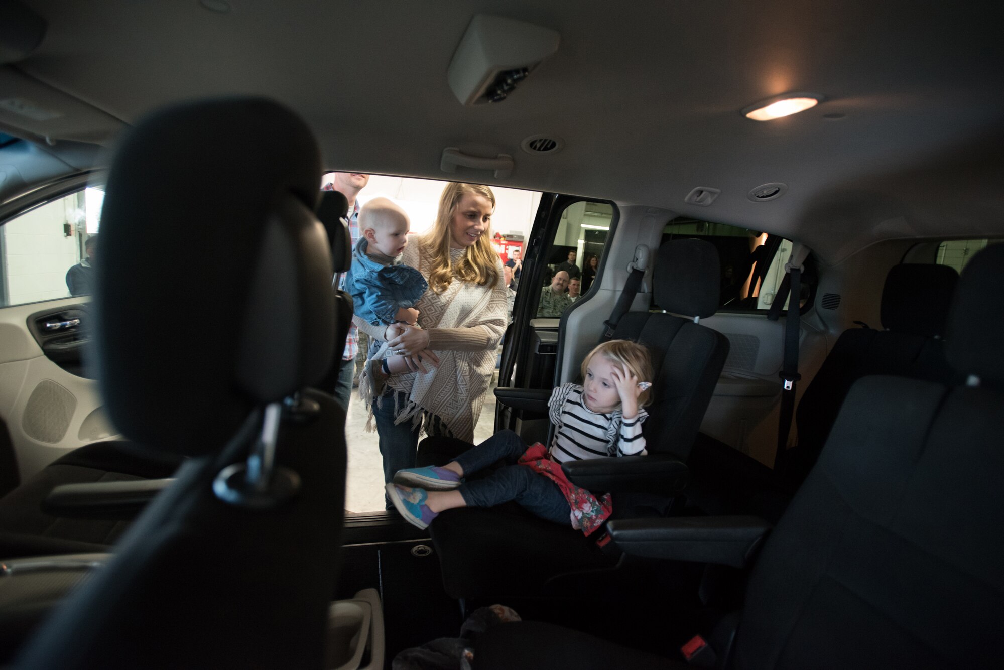Amanda Goodlin, wife of the Kentucky Air National Guard’s Staff Sgt. Neil Goodlin, inspects the family’s new minivan with her son, Dash, and daughter, Ava, at Oxmoor Collision Center in Louisville, Ky., Nov. 20, 2015. The van was donated to the Goodlins as part of the National Auto Body Council’s “Recycled Rides” program, which restores wrecked vehicles to like-new condition before giving them to needy individuals. (U.S. Air National Guard photo by Maj. Dale Greer)