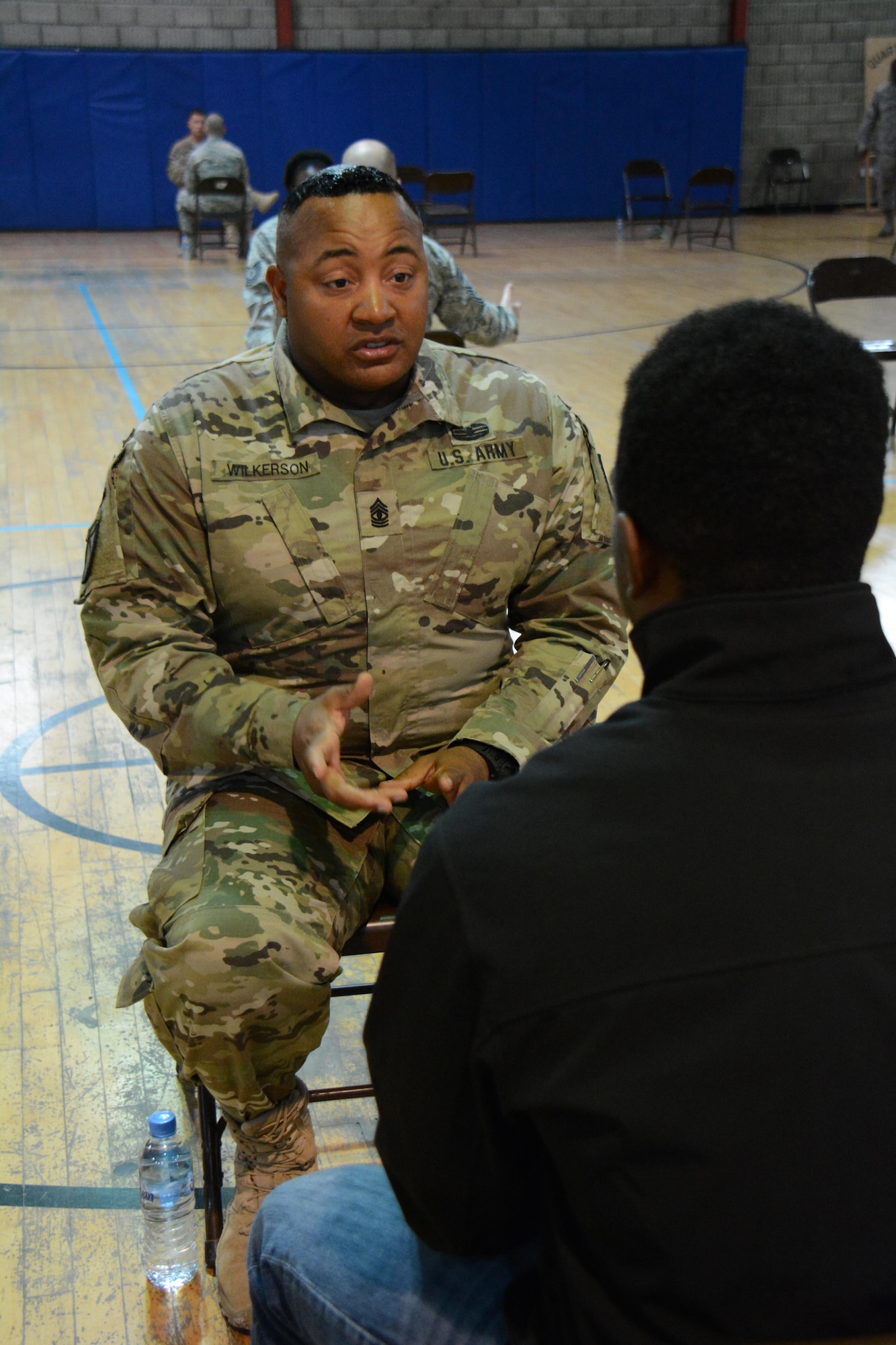 U.S. Army 1st Sgt. Joseph Wilkerson, Headquarters Battery, 1st Battalion, 2nd Air Defense Artillery, shares career advice during an airman mentoring session at Al Udeid Air Base, Qatar Nov. 25. The session featured 35 senior non-commissioned officers sharing career guidance with 26 airmen. Airmen who attended the session were able to get different perspectives from several SNCOs on the best way to grow personally and professionally. Wilkerson has served 27 years in the Army and said he enjoyed sharing his knowledge with others. (U.S. Air Force photo by Tech. Sgt. James Hodgman/Released)