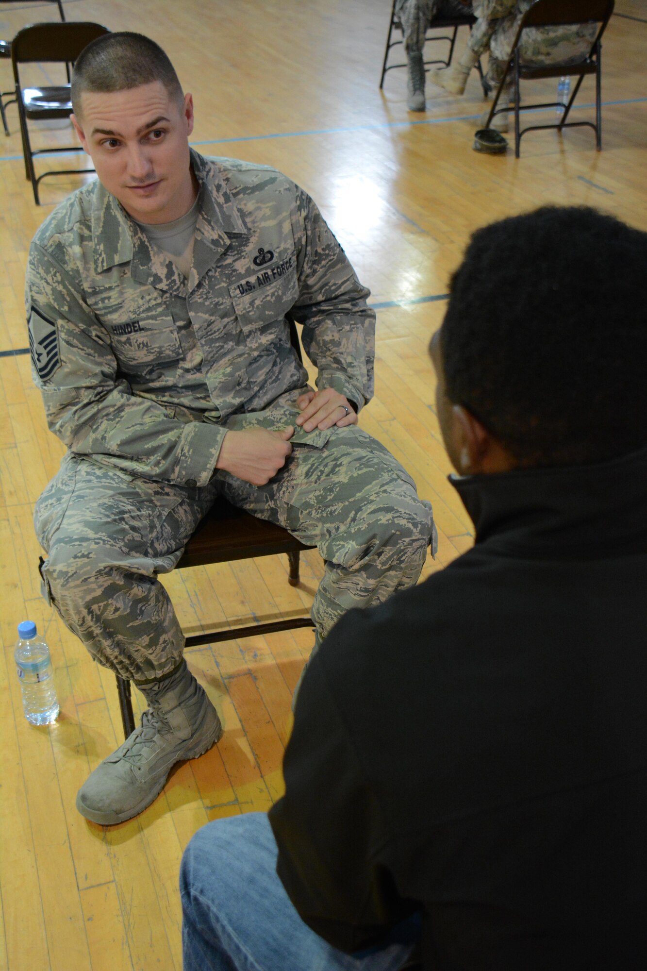Master Sgt. Dustin Hindel, U.S. Air Force’s Central Financial Management Directorate deputy disbursing officer, listens as an airman asks a question during an airman mentoring session at Al Udeid Air Base, Qatar Nov. 25. The session featured 35 SNCOs sharing career guidance with 26 airmen. Airmen who attended the session were able to get different perspectives from several senior noncommissioned officers on the best way grow personally and professionally. (U.S. Air Force photo by Tech. Sgt. James Hodgman/Released)