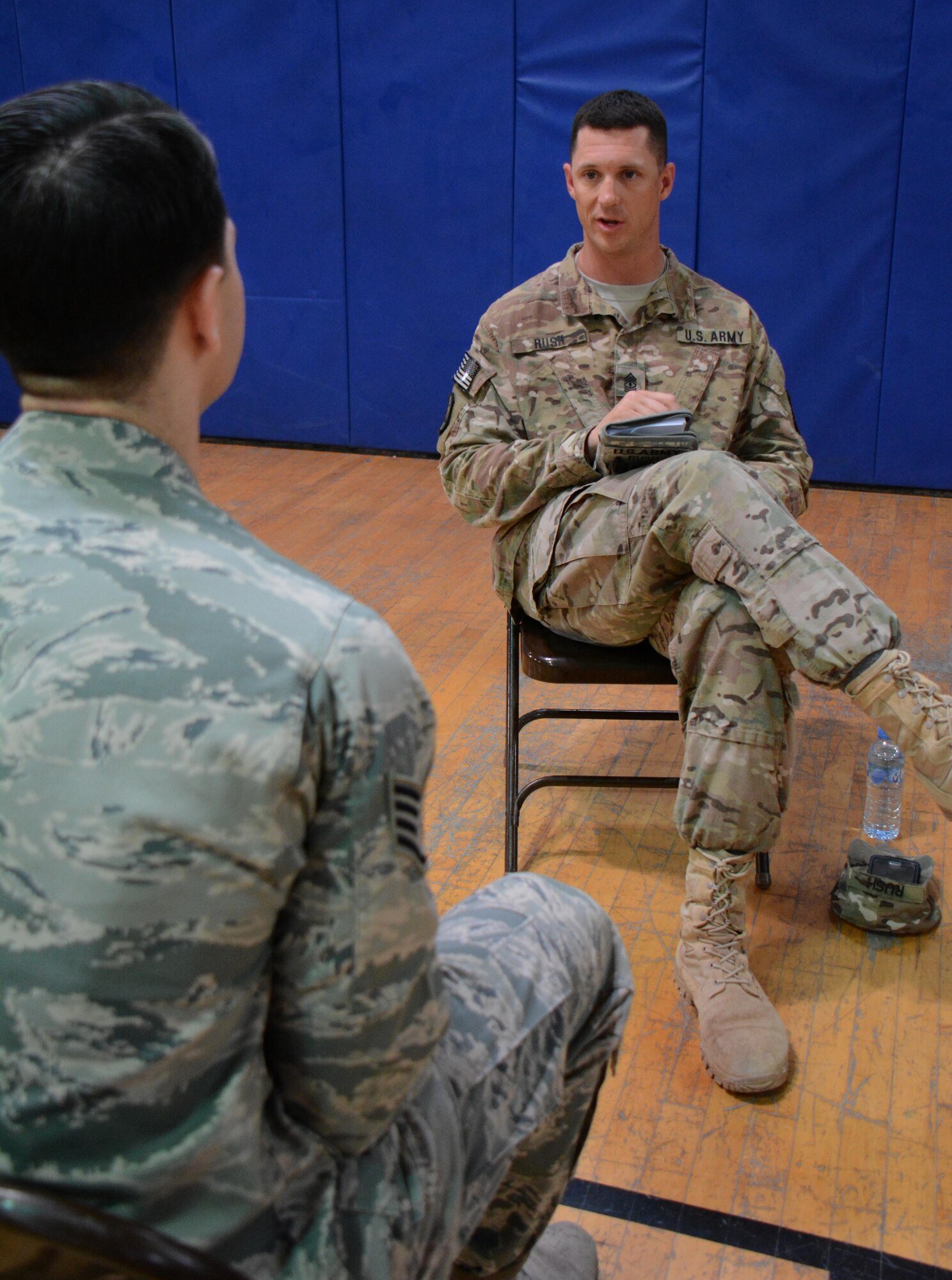 U.S. Army 1st Sgt. Clifton Rush, Delta Battery, 1st Battalion, 62nd Air Defense Artillery, shares career advice during an airman mentoring session at Al Udeid Air Base, Qatar Nov. 25. The session featured 35 senior noncommissioned officers sharing career guidance with 26 airmen. Airmen who attended the session were able to get different perspectives from several SNCOs on the best way to grow personally and professionally. Rush has been in the Army for almost 20 years and said he enjoyed sharing his knowledge with others. (U.S. Air Force photo by Tech. Sgt. James Hodgman/Released)