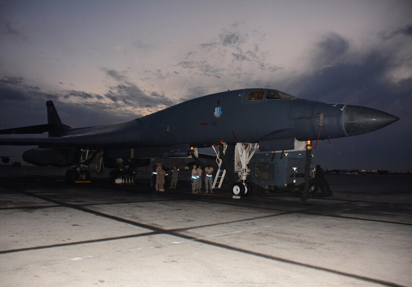 A B-1 Lancer sits on the flight line at Al Udeid Air Base, Qatar Nov. 24. The aircraft was featured during a tour and presentation of the B-1's capabilities. Forty service members took part in the tour which featured videos showcasing strikes the bomber has conducted. (U.S. Air Force photo by Tech. Sgt. James Hodgman/Released)
