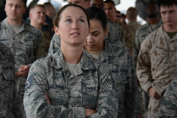 Staff Sgt. Ashley Singleton, Combined Air and Space Operations Center, looks inside the bomb bay of a B-1 Lancer Nov. 24 at Al Udeid Air Base, Qatar. Singleton joined 39 other service members for a tour of the B-1. The tour featured a presentation on the B-1's capabilities and videos showcasing strikes the bomber has carried out. Service members were selected for the tour by their unit leadership for outstanding performance. (U.S. Air Force photo by Tech. Sgt. James Hodgman/Released)