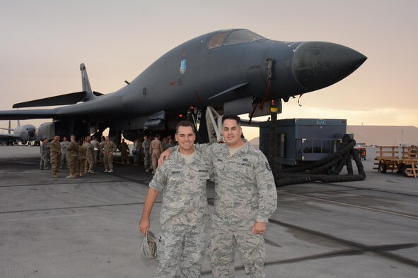 Staff Sgt. Michael Geremia, Central Command Forward Headquarters unit deployment manager (Left), and Tech. Sgt. Miguel Rivera, CENTCOM Forward HQ power production specialist (Right), pose for a photo in front of a B-1 Lancer at Al Udeid Air Base, Qatar Nov. 24. Geremia and Rivera joined 38 other service members for a tour of the B-1 and learned about the aircraft’s capabilities. The tour featured a presentation on the B-1’s strategic impact and included videos showcasing strikes the bomber has carried out. (U.S. Air Force photo by Tech. Sgt. James Hodgman/Released)