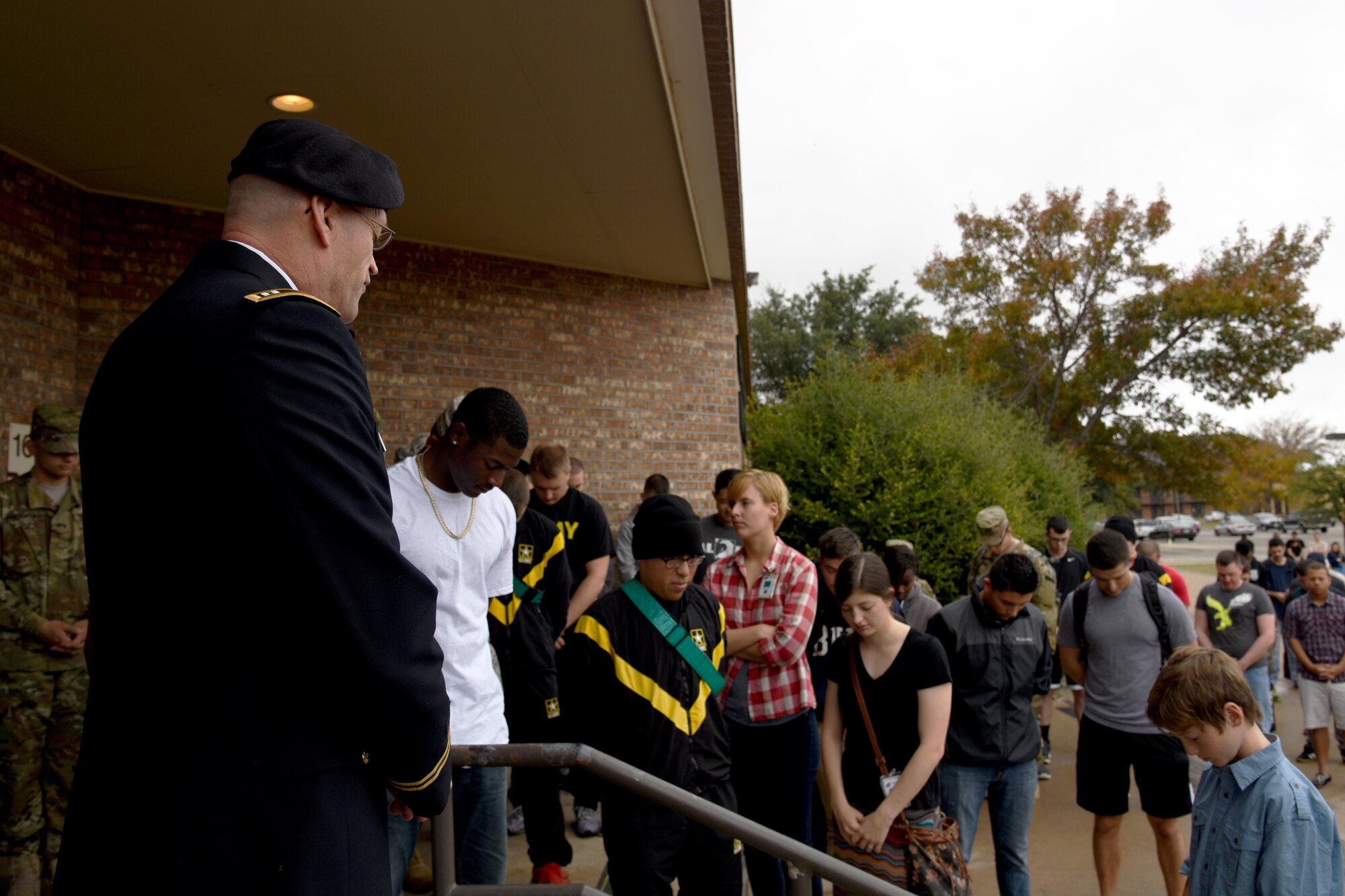 U.S. Army Chaplain (Capt.) Patrick D. Ireland, Army 344th Military Intelligence Battalion, provides an opening prayer for Thanksgiving at the Western Winds Dining Facility on Goodfellow Air Force Base, Texas, Nov. 26, 2015. Base leadership took turns serving service members, retirees and dependents for Thanksgiving. (U.S. Air Force photo by Senior Airman Joshua Edwards/Released)