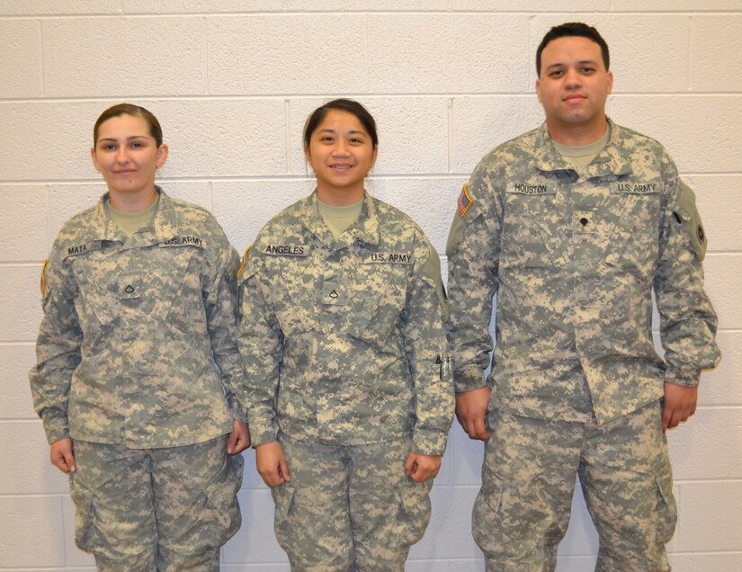 Pfc. Genephere Mata, Pfc. Kassandra Angeles and Spc. Marcos Houston, members of the 650th Regional Support Group, participated in a Joint Culinary Training Program exercise at the George W. Dunaway Army Reserve Center in Sloan, Nev., Nov. 15, where they trained and learned extra culinary skills at this event.
