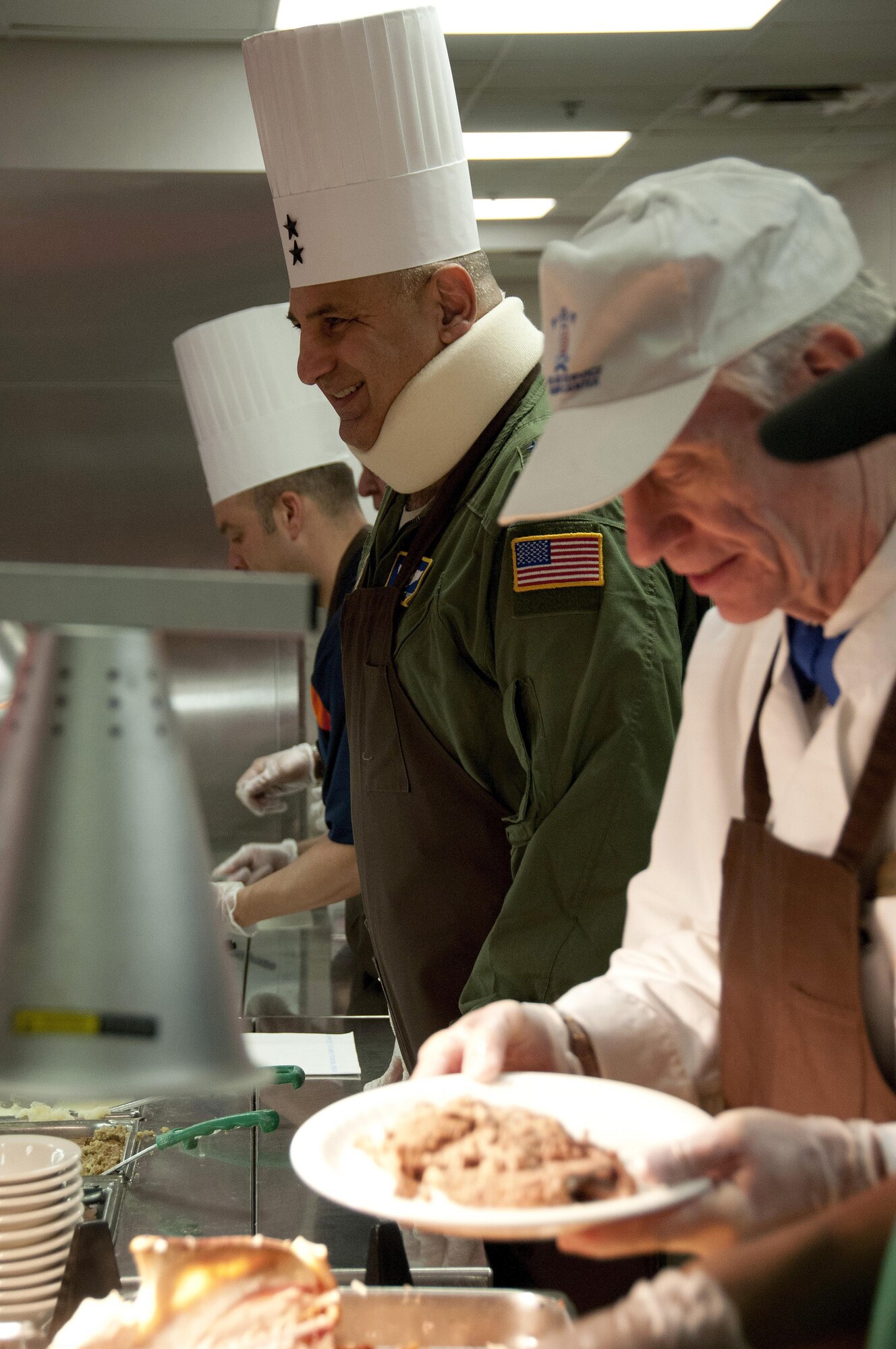 Maj. Gen. Richard S. "Beef" Haddad, Air Force Reserve Command vice commander, serves Thanksgiving lunch at the Wynn Dining Facility at Robins Air Force Base, Ga., Nov 26, 2015. Haddad volunteered to serve the special holiday lunch to service members. (U.S. Air Force photo by Robert Helton/RELEASED)