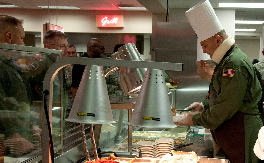 Maj. Gen. Richard S. "Beef" Haddad, Air Force Reserve Command vice commander, serves Thanksgiving lunch at the Wynn Dining Facility at Robins Air Force Base, Ga., Nov 26, 2015. Haddad volunteered to serve the special holiday lunch to service members. (U.S. Air Force photo by Robert Helton/RELEASED)