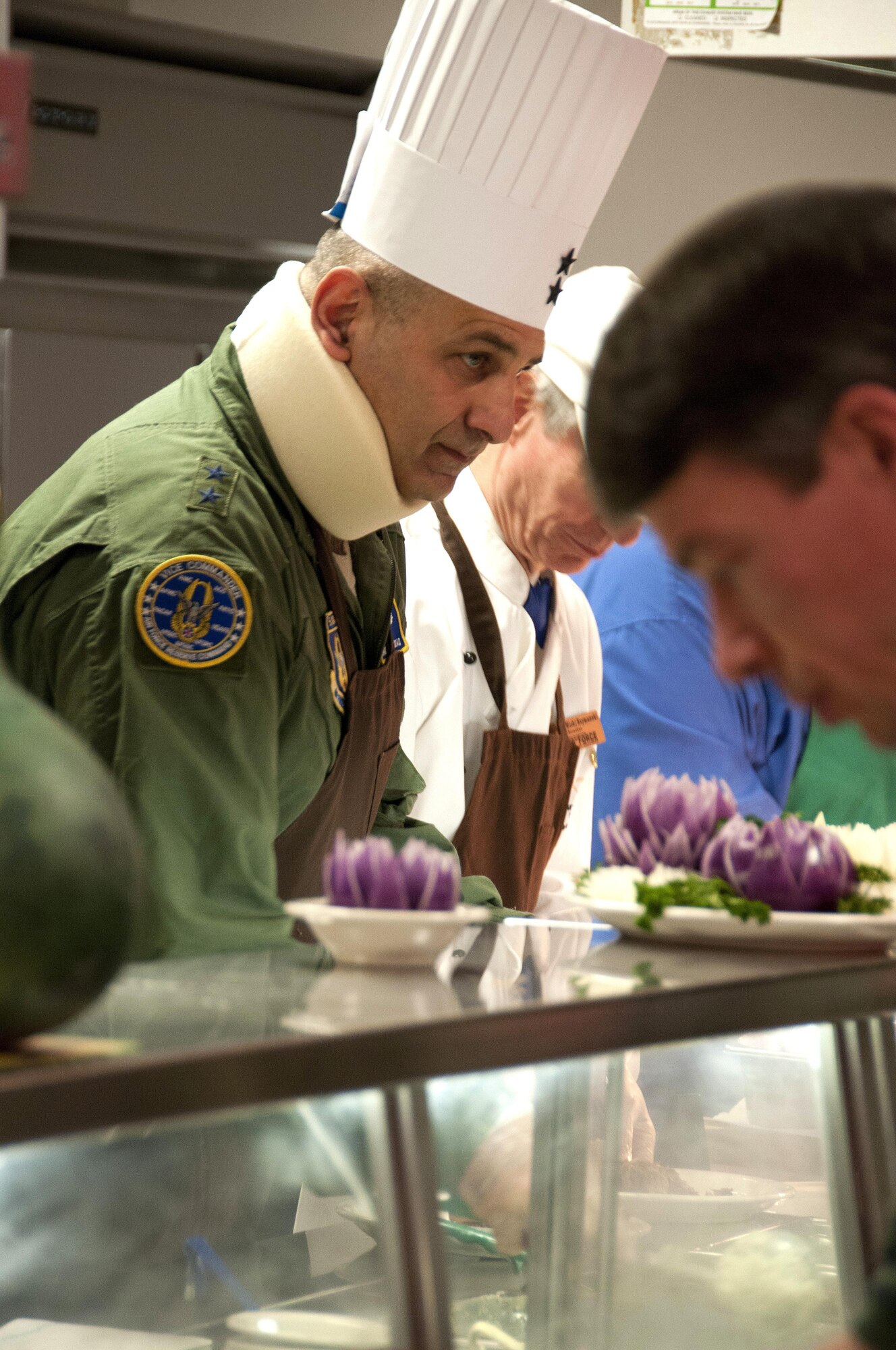 Maj. Gen. Richard S. "Beef" Haddad, Air Force Reserve Command vice commander, serves Thanksgiving lunch at the Wynn Dining Facility at Robins Air Force Base, Ga., Nov 26, 2015. Haddad volunteered to serve the special holiday lunch to service members. (U.S. Air Force photo by Robert Helton/RELEASED)