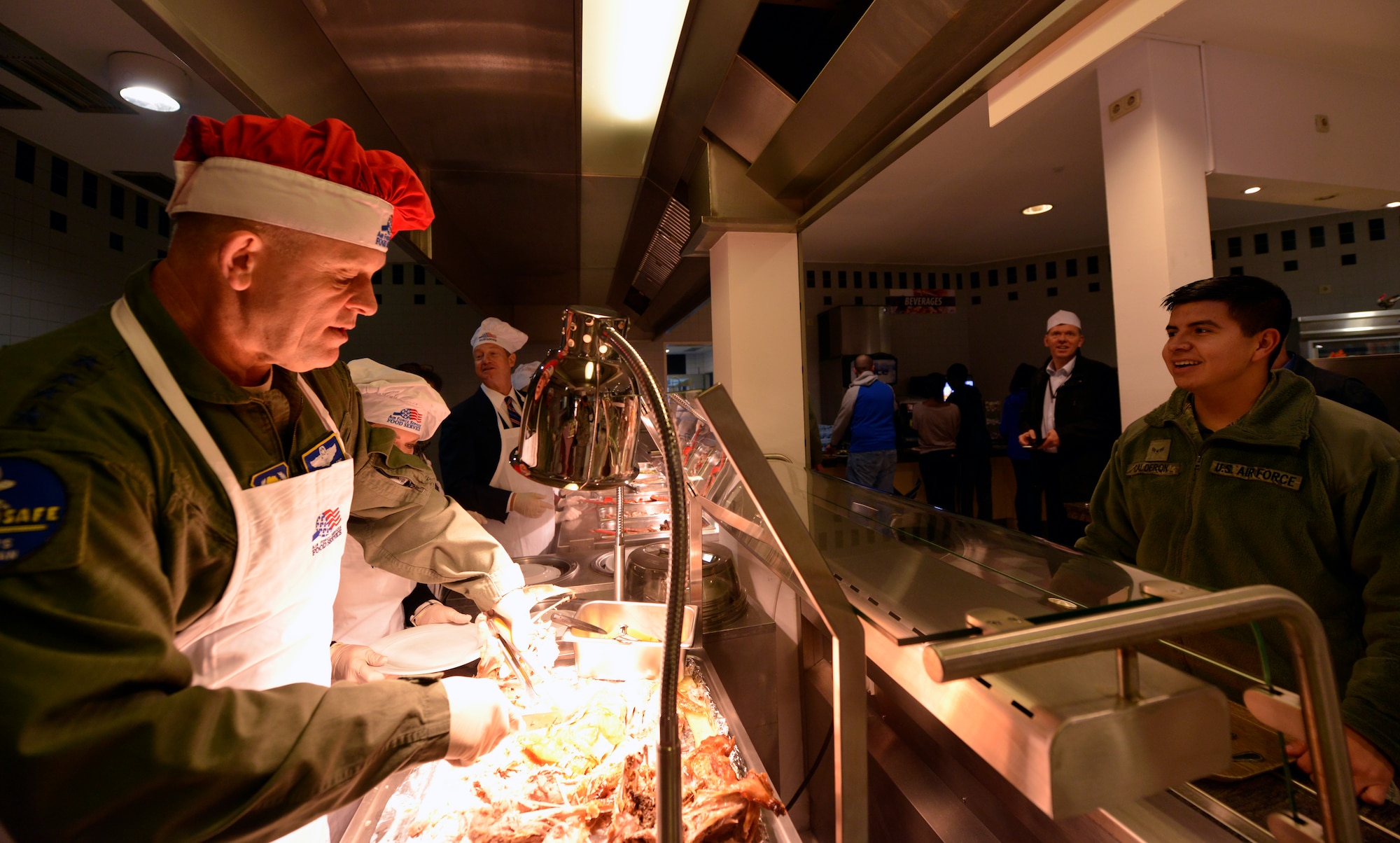 Gen. Frank Gorenc, U.S. Air Forces in Europe and Air Forces Africa commander, carves a turkey at the Rheinland Inn Dining Facility Nov. 26, 2015, at Ramstein Air Base, Germany. Leaders gathered to serve holiday meals to Airmen and their families and to wish everyone a safe and happy holiday. (U.S. Air Force photo/Staff Sgt. Sharida Jackson)