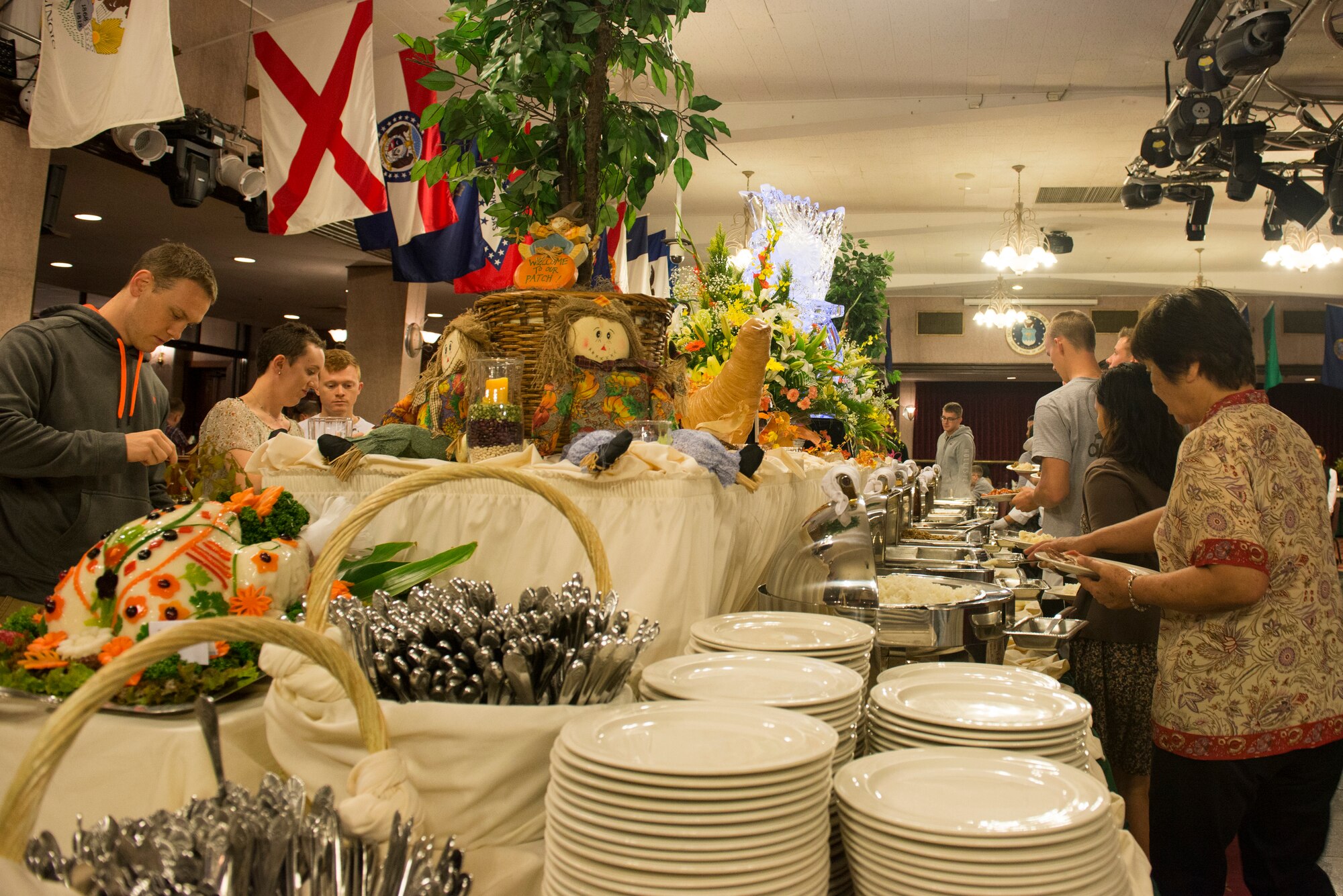 Service members and their families enjoy Thanksgiving Nov. 26, 2015, at the Rocker NCO Club at Kadena Air Base, Japan. Wing leadership also personally delivered meals to units and service members unable to attend. (U.S. Air Force photo by Senior Airman Omari Bernard)