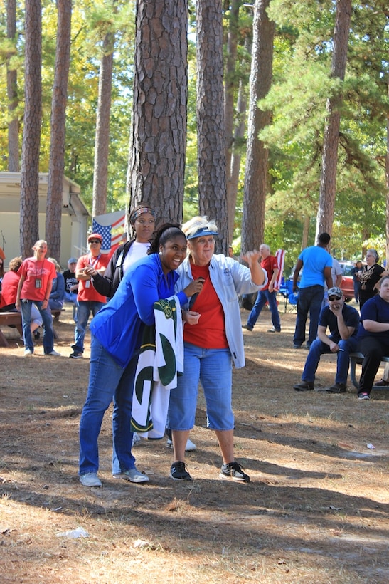 Kizzie Robinson and Kathy Braley, DLA Distribution Red River, Texas, employees prepare to try and dunk Army Lt. Col. Stoeger at the annual Employee Appreciation Day on Oct.16.