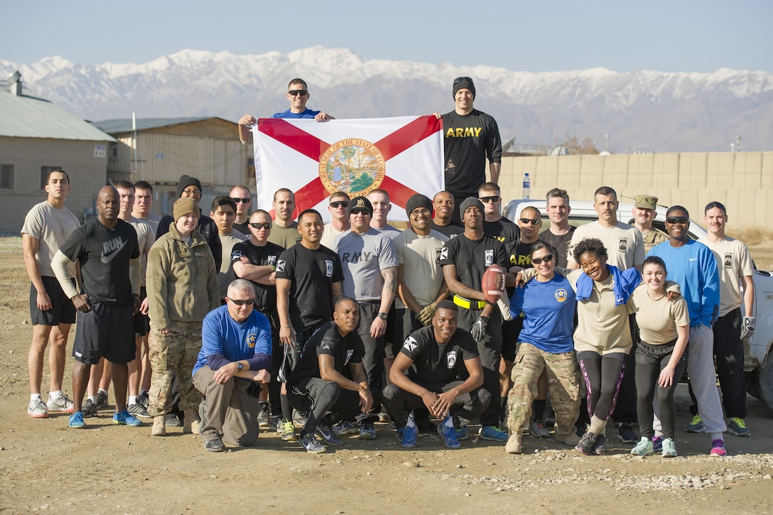 U.S. soldiers play U.S. airmen in a friendly "Turkey Bowl" football game on Bagram Airfield, Afghanistan, Nov. 26, 2015. The soldiers are assigned to Florida Army National Guard's 1st Battalion, 265th Air Defense Artillery Regiment, and the airmen are assigned to Florida Air National Guard's 290th Joint Communications Support Squadron. The Army team won the game 42-35. U.S. Air Force photo by Tech. Sgt. Robert Cloys