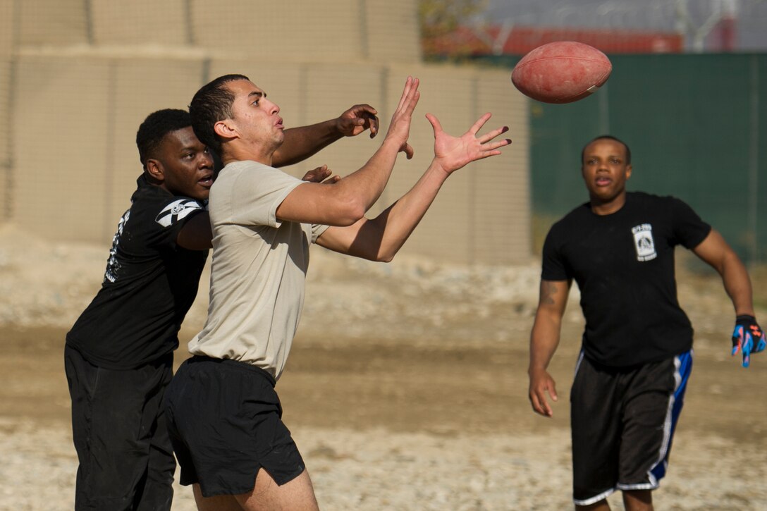 U.S. soldiers play U.S. airmen in a friendly "Turkey Bowl" football game on Bagram Airfield, Afghanistan, Nov. 26, 2015. The soldiers are assigned to Florida Army National Guard's 1st Battalion, 265th Air Defense Artillery Regiment, and the airmen are assigned to Florida Air National Guard's 290th Joint Communications Support Squadron. The Army team won the game 42-35. U.S. Air Force photo by Tech. Sgt. Robert Cloys