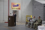 Robert Montefour, site director for Defense Logistics Agency Installation Support at Defense Distribution Susquehanna opens the ribbon ceremony for warehouse 780 on Nov. 16.