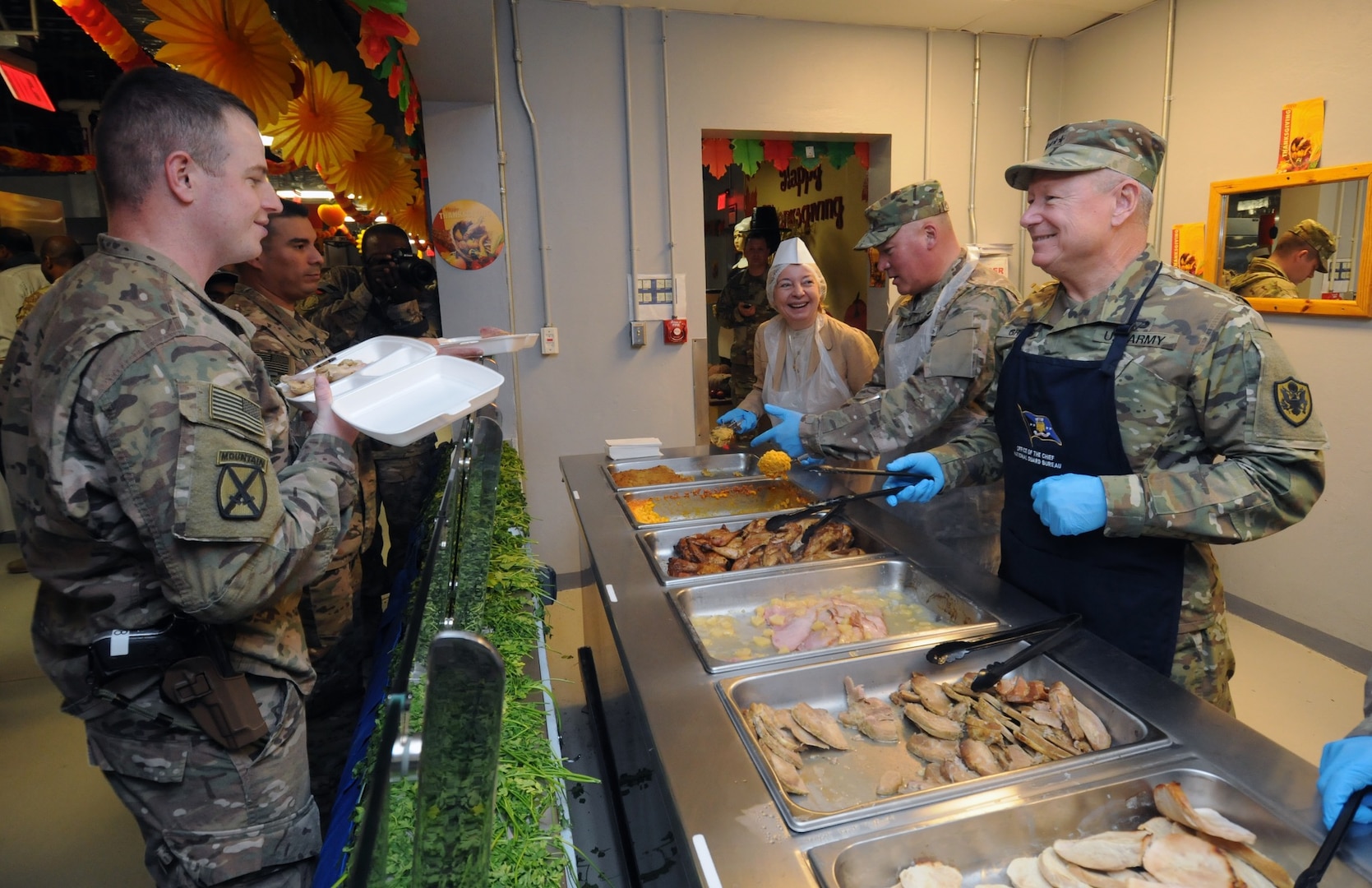 Gen. Frank Grass, chief of the National Guard Bureau, serves turkey to Soldiers in Afghanistan on Nov. 26, 2015. 